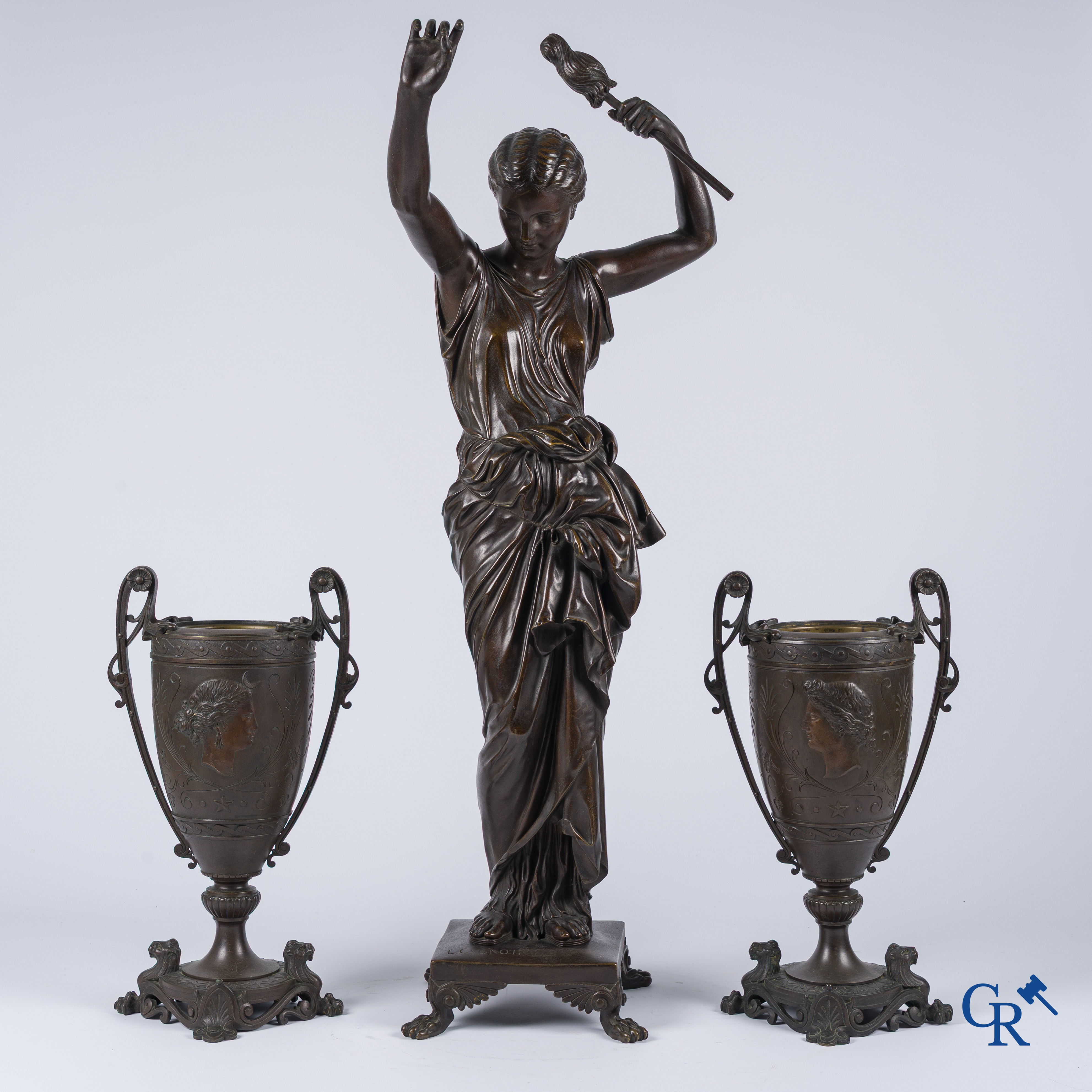 Louis Léon Cugnot (1835-1894) A large 3-piece bronze chimney set "La Fileuse" Signed L. Cugnot.