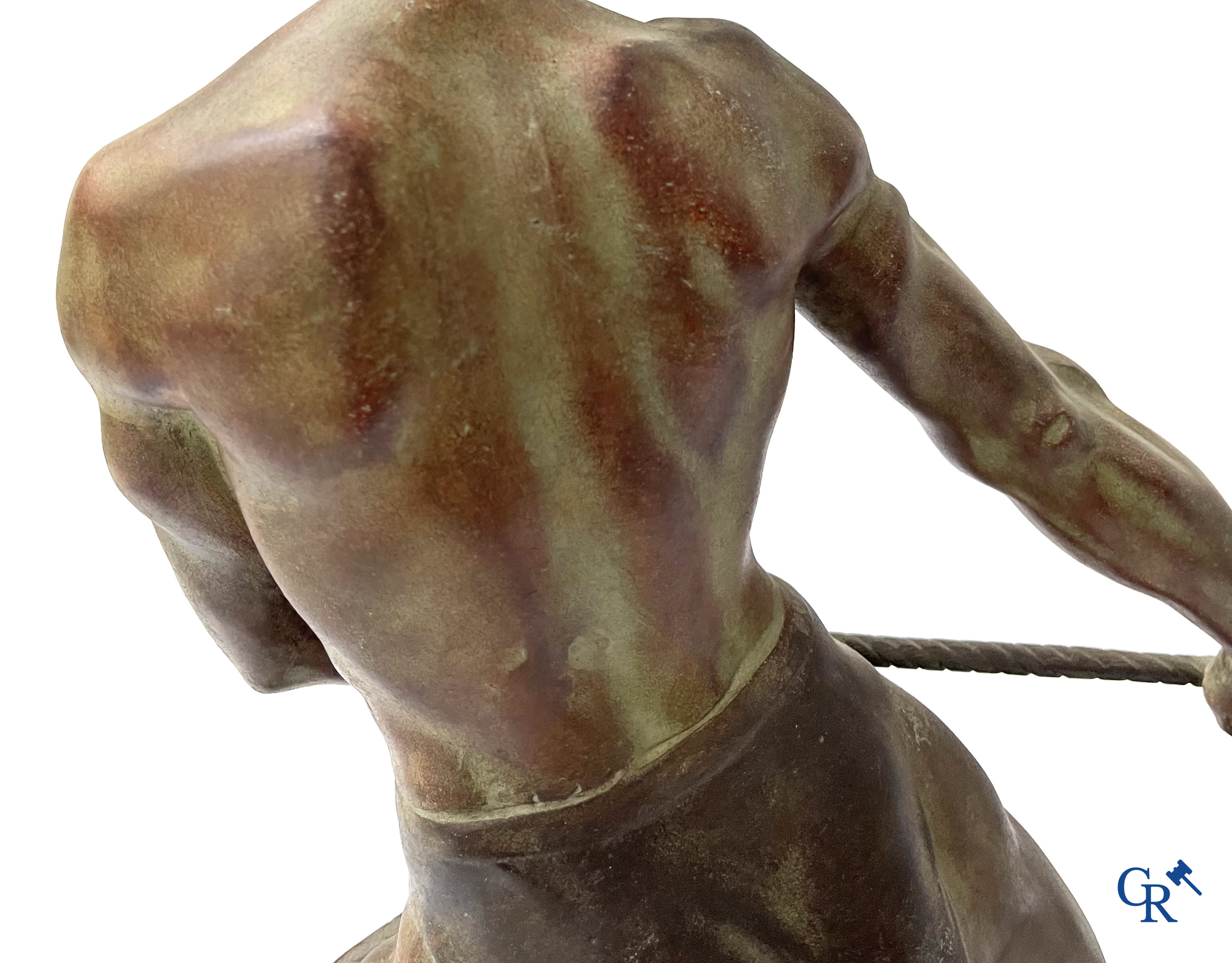 Art deco, a statue in green-brown patinated spelter on a black marble base. Around 1930.