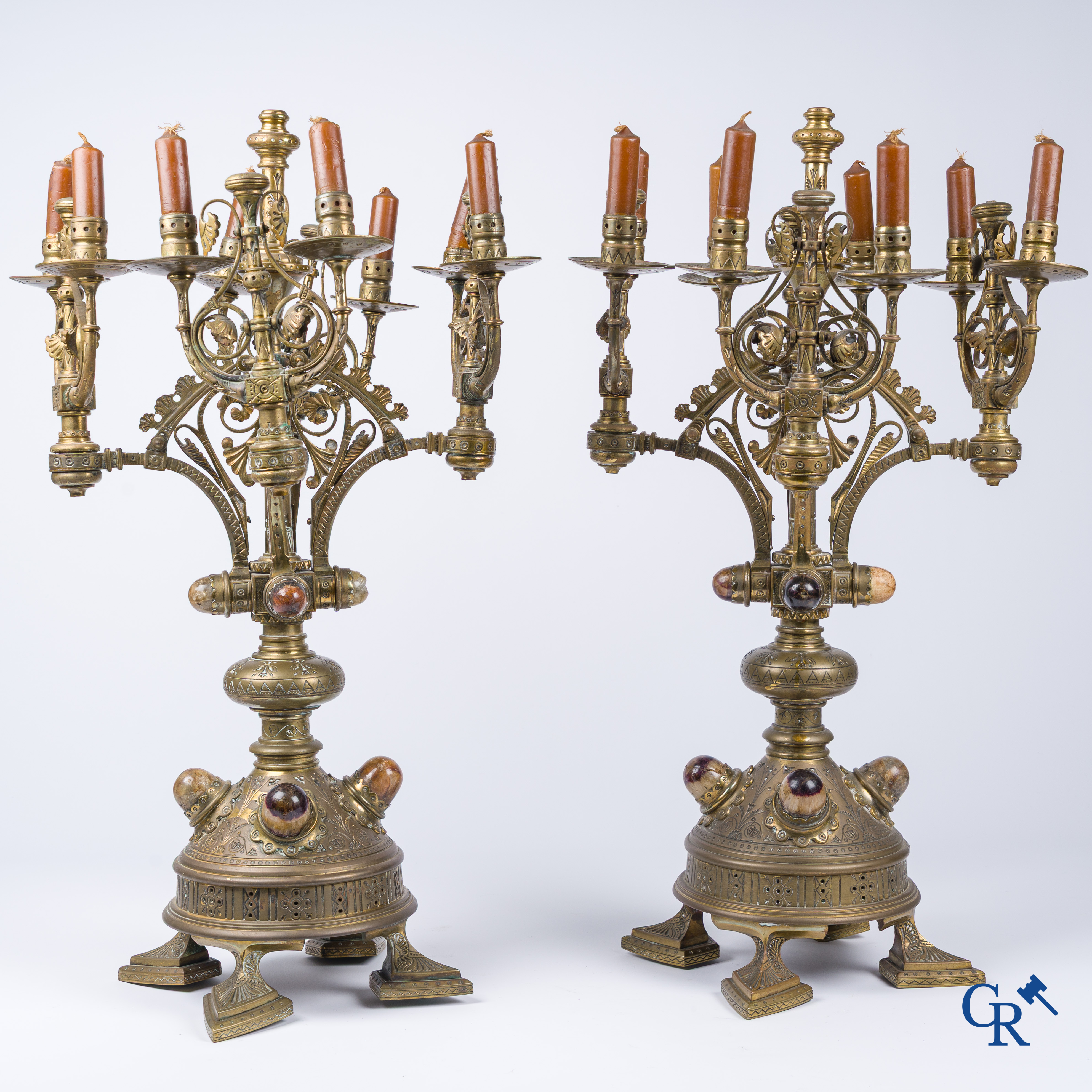 A pair of important bronze candlesticks decorated with various types of rock including amethyst. 19th century.