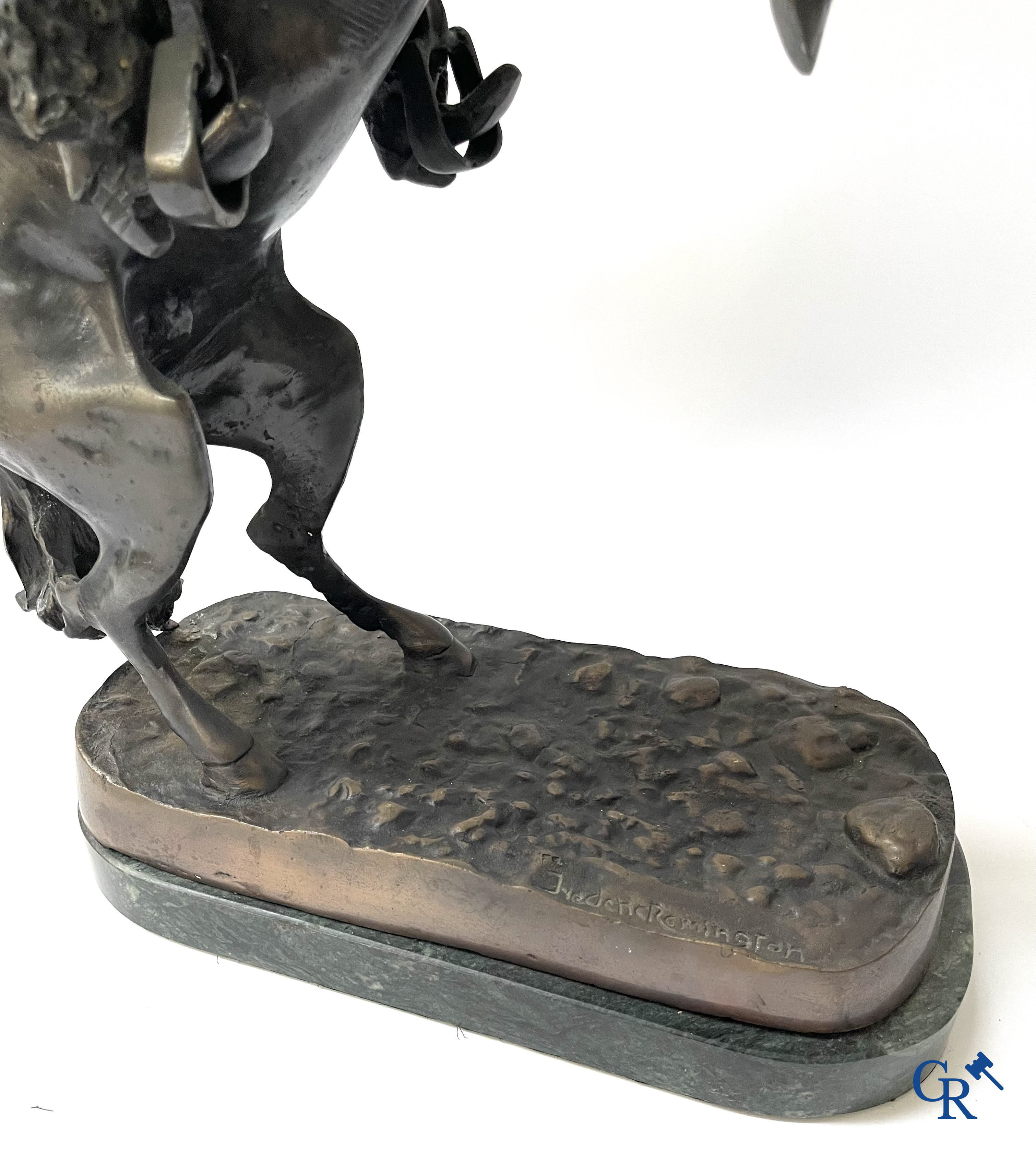 Frederic Remington (after) The bronco buster. Bronze on a green veined marble base. Posthumous. 20th century.