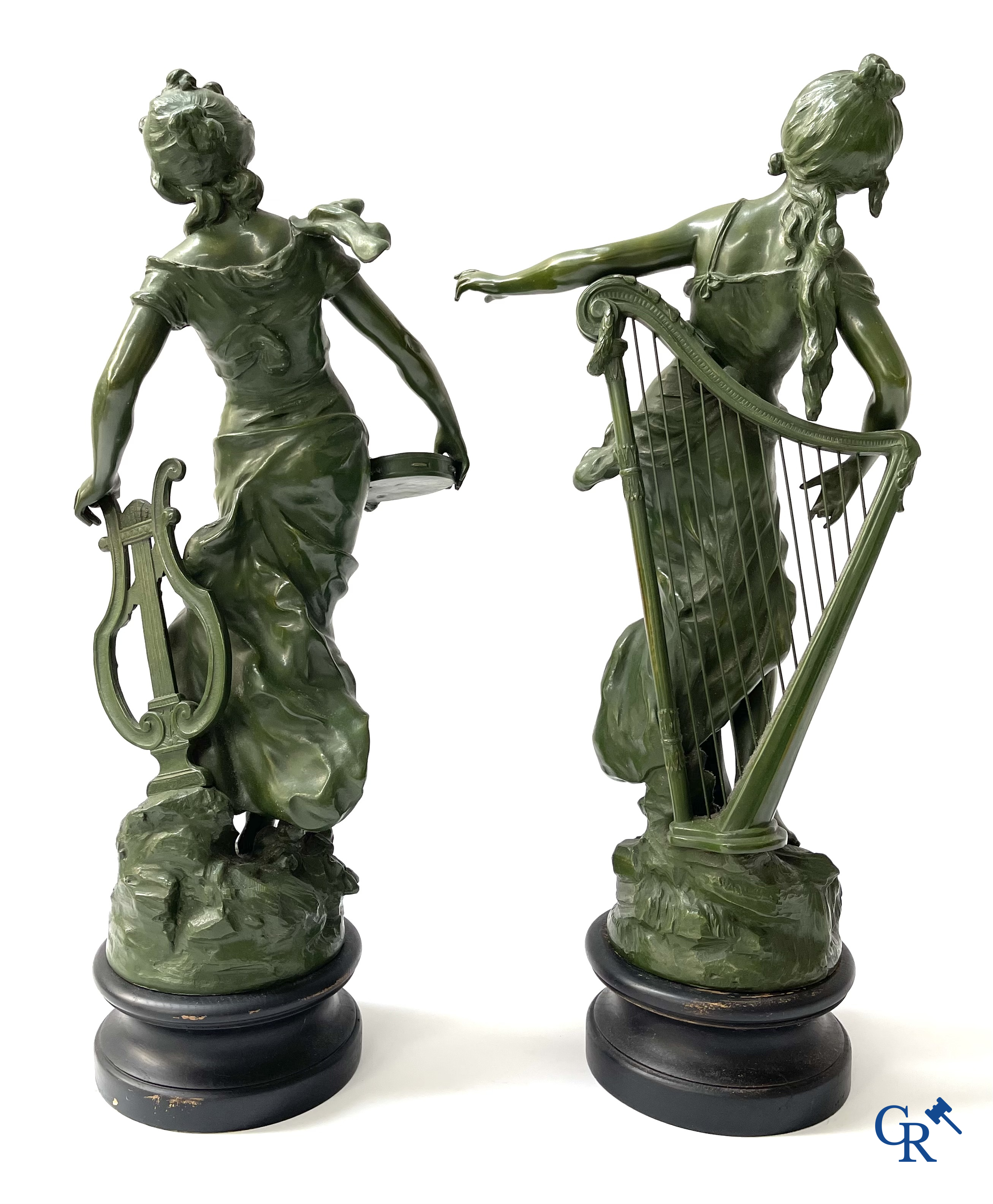 Louis & François Moreau, A large pair of statues in green patinated spelter on a wooden base. Signed L&F Moreau.