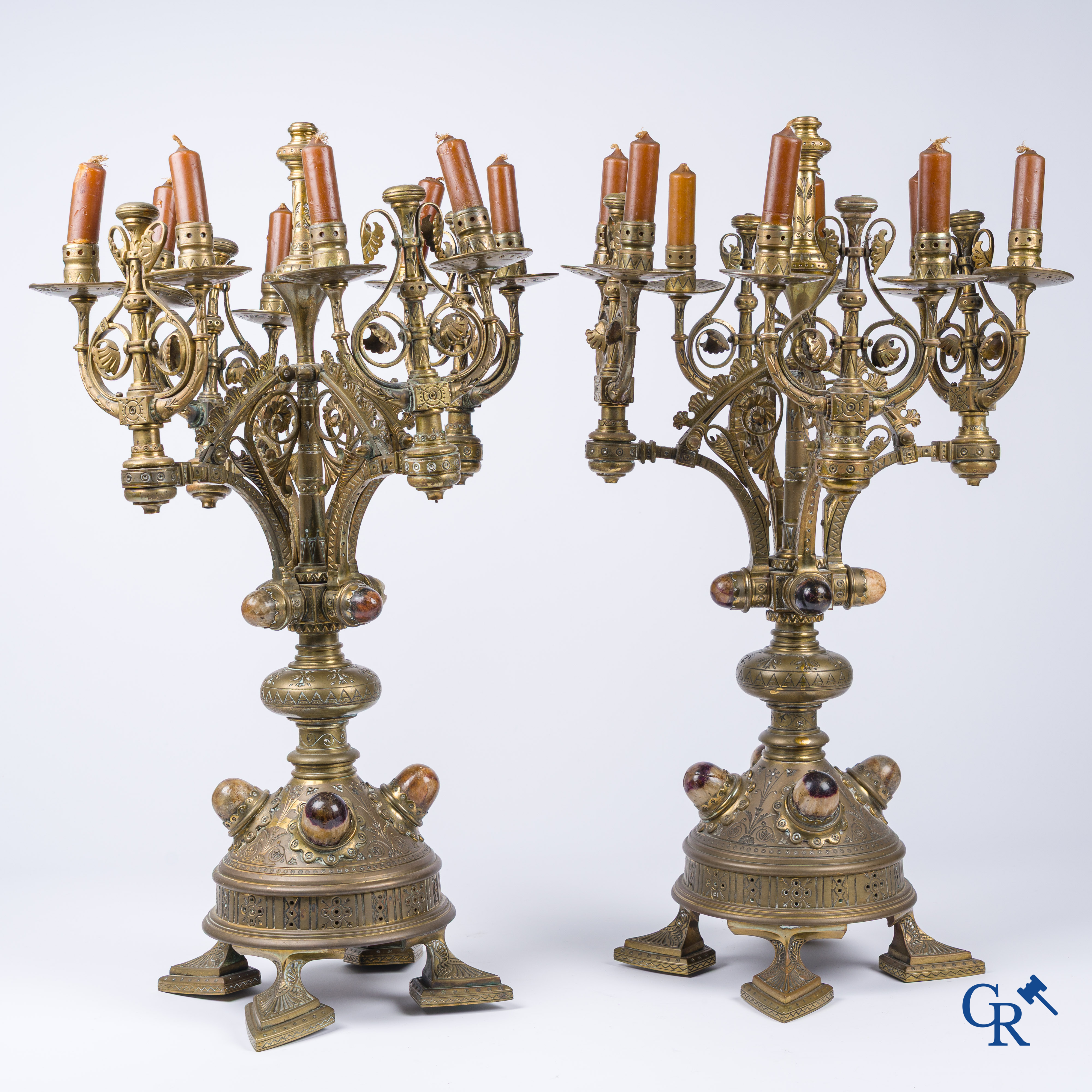 A pair of important bronze candlesticks decorated with various types of rock including amethyst. 19th century.
