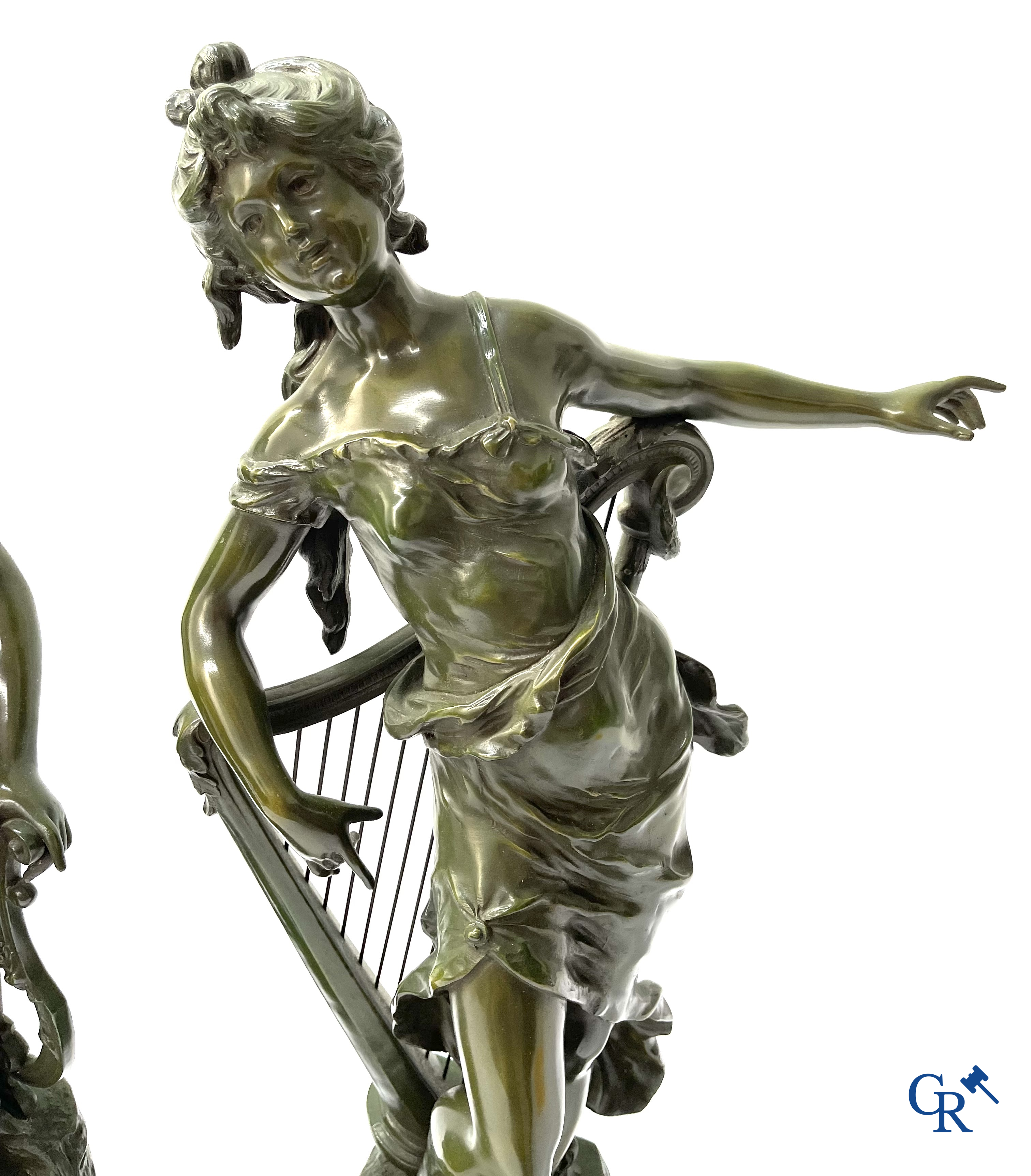 Louis & François Moreau, A large pair of statues in green patinated spelter on a wooden base. Signed L&F Moreau.