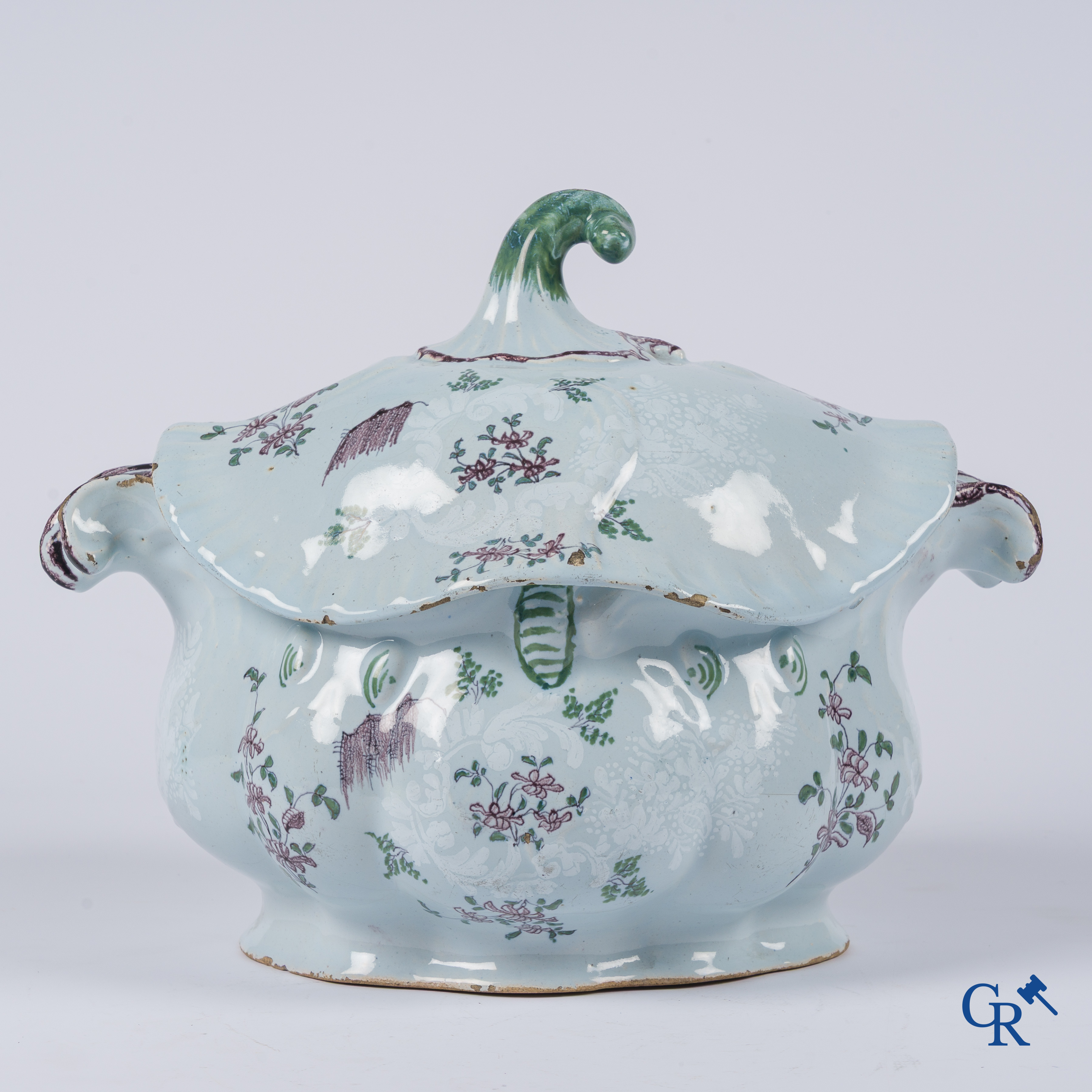 Earthenware. A large 18th century tureen and its lid in enamelled faience.