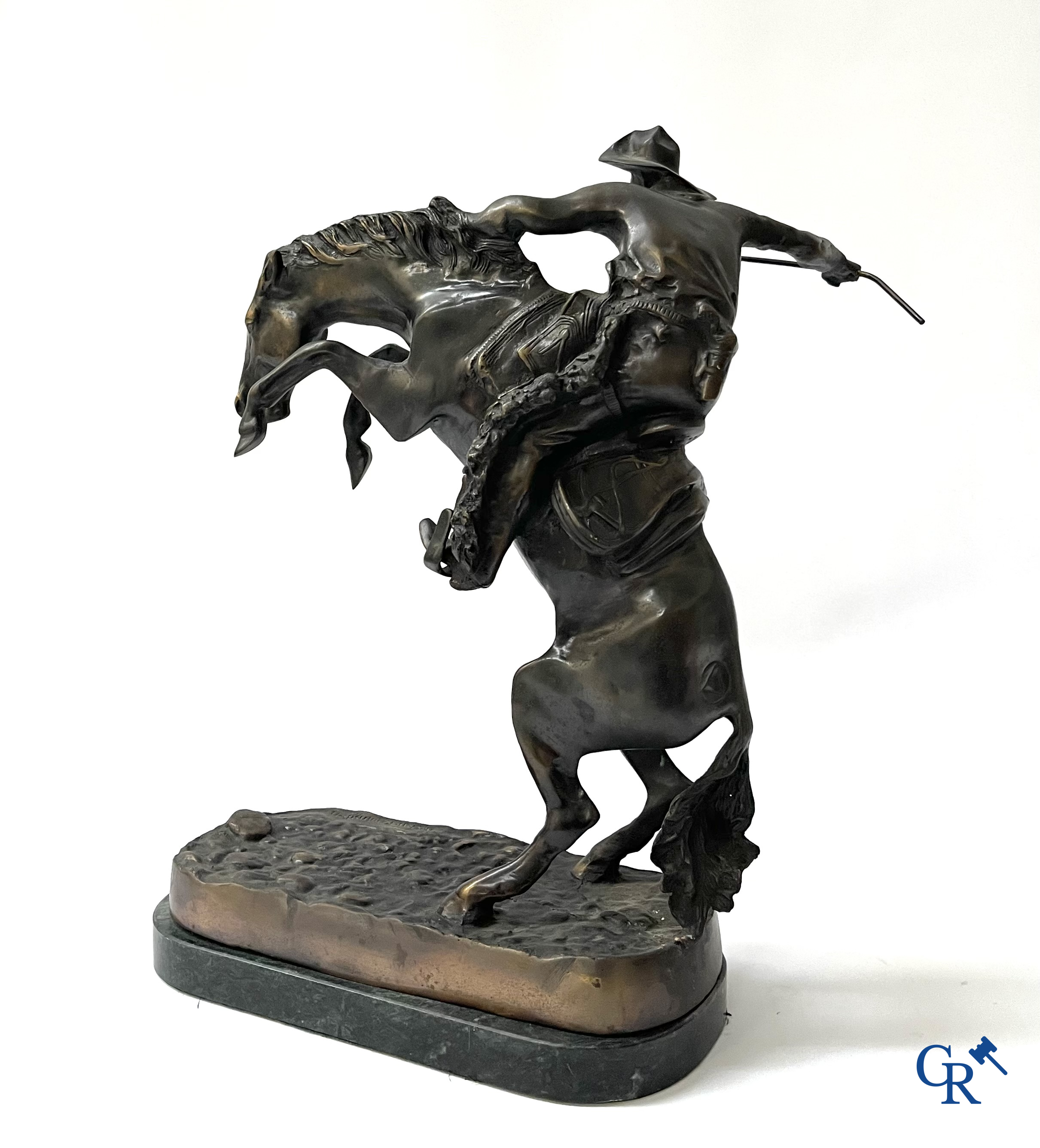 Frederic Remington (after) The bronco buster. Bronze on a green veined marble base. Posthumous. 20th century.