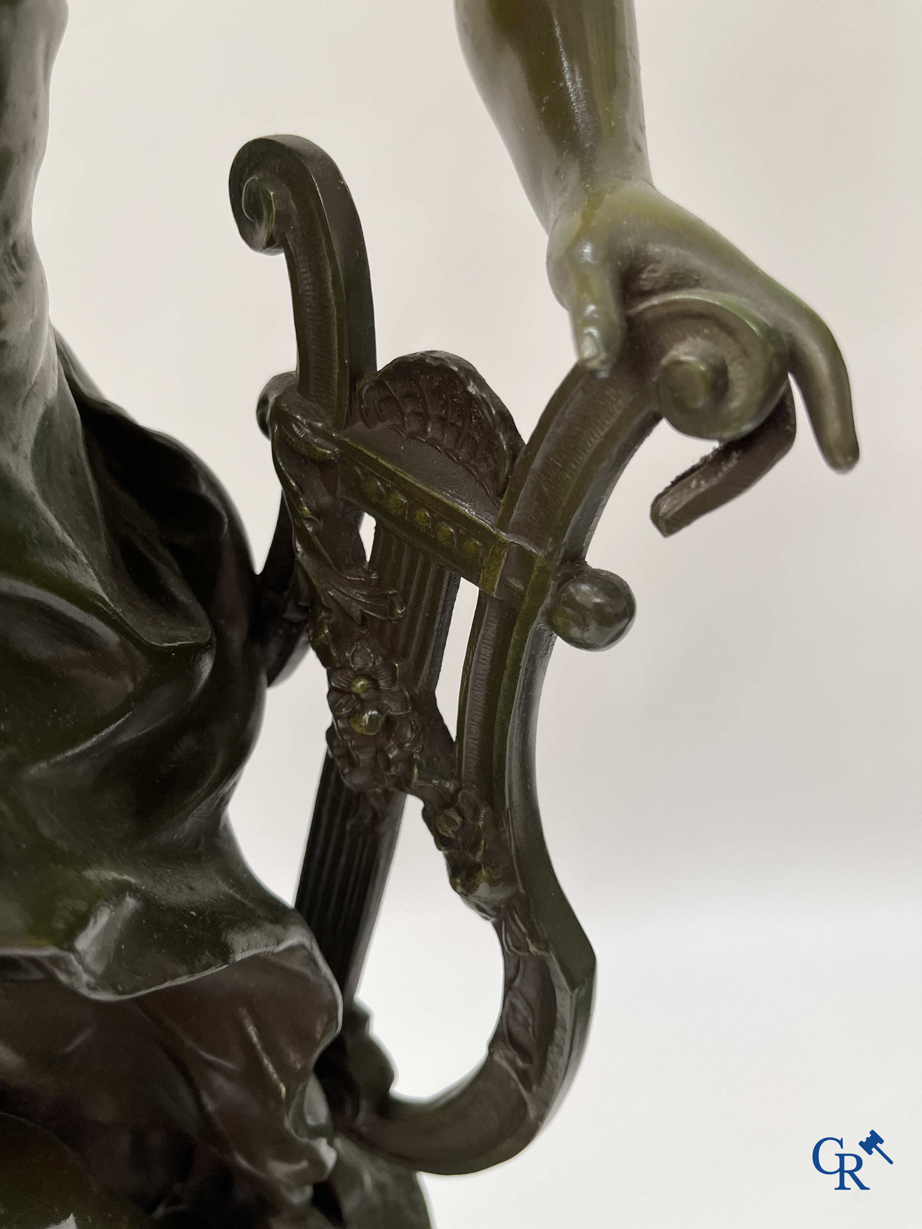Louis & François Moreau, A large pair of statues in green patinated spelter on a wooden base. Signed L&F Moreau.
