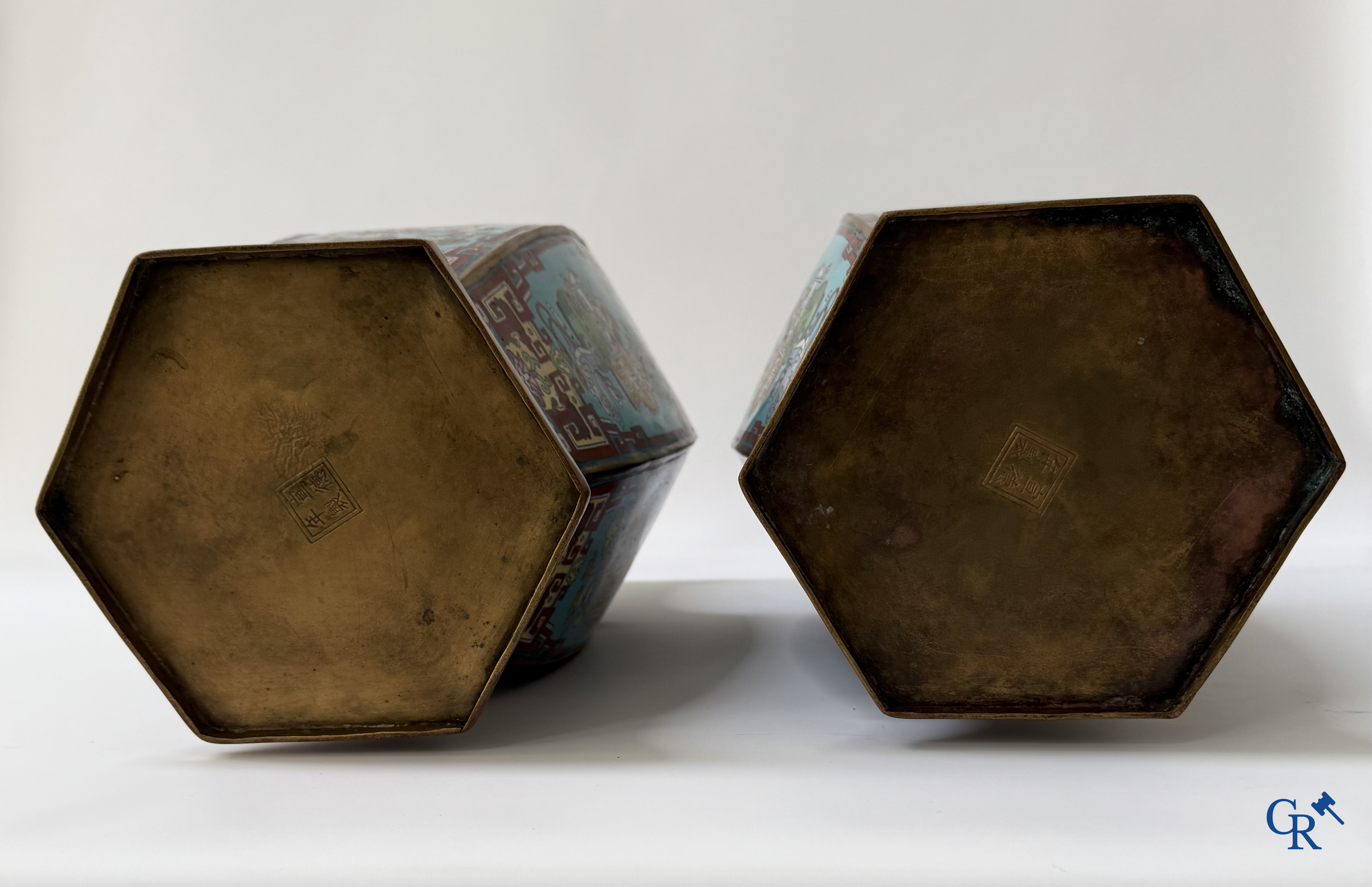 Asian Art, a large pair of hexagonal Chinese cloisonné vases with a decor of antiques.
