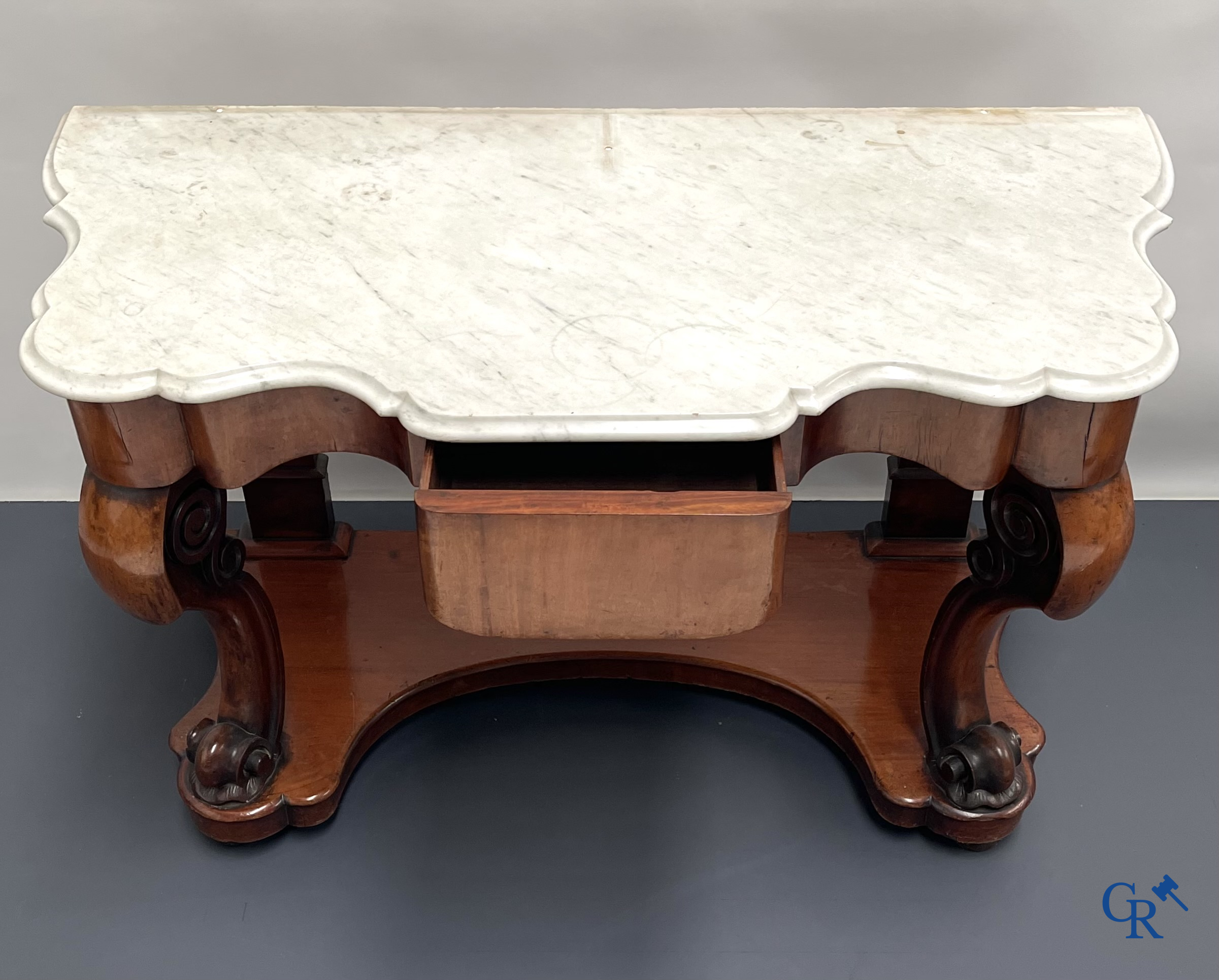 Een console met lade in mahoniehout en marmer. Louis Philippe periode.