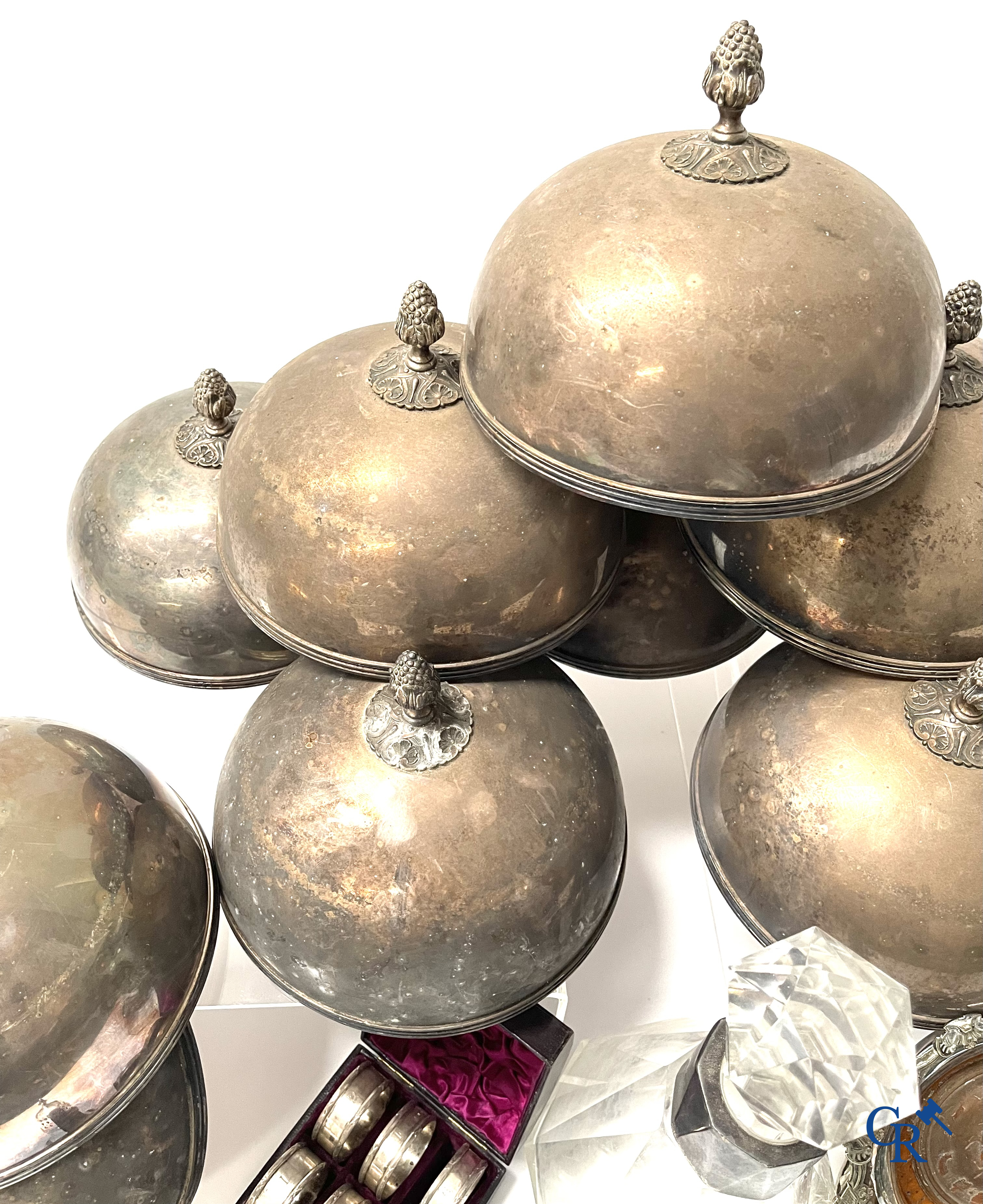 A set of 10 silver-plated metal table bells, a carafe with silver frame, silver napkin rings, a sprinkler bus, etc.