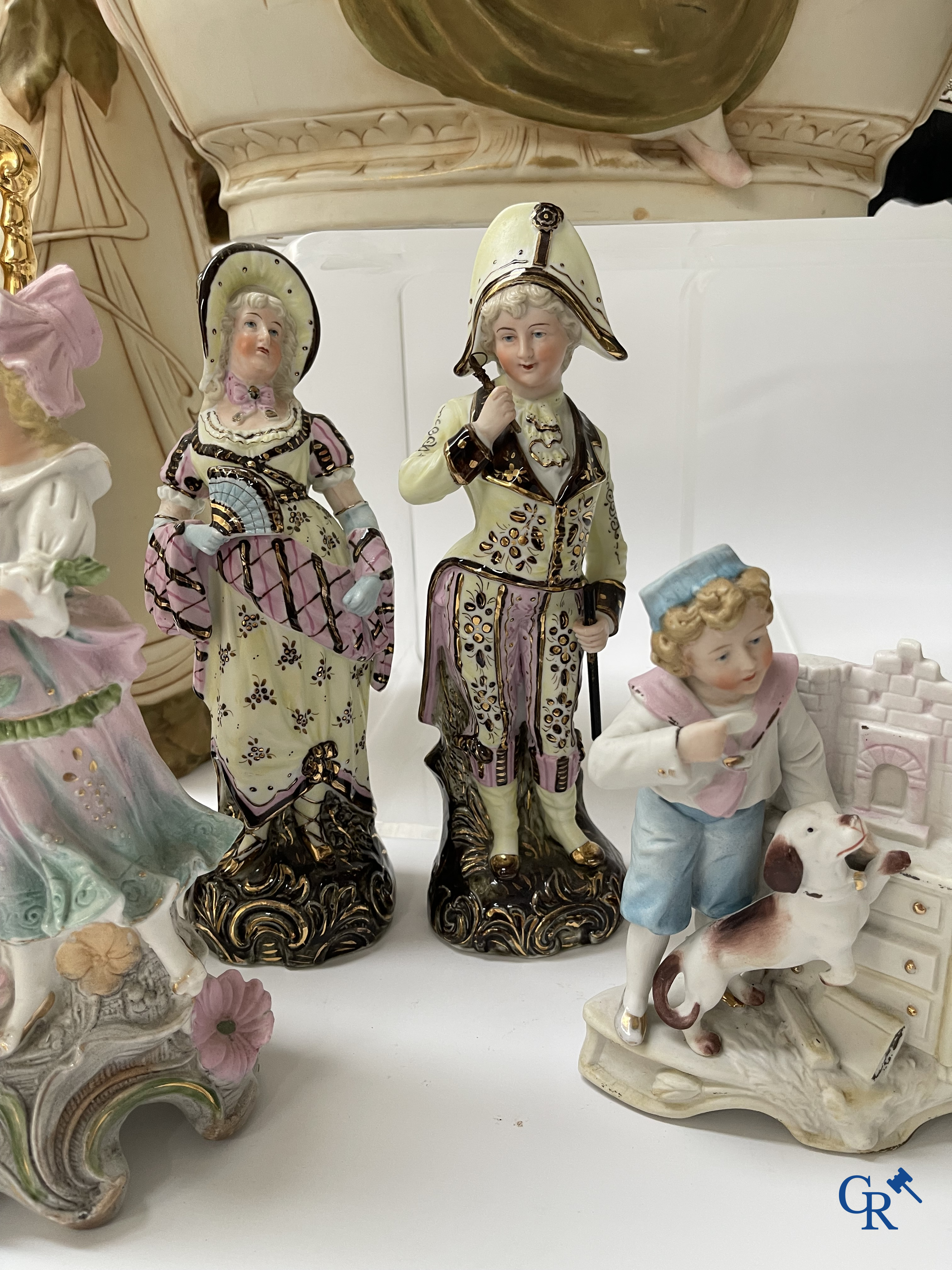 A large lot of brocante including Royal Dux, Biscuit statues, porcelain, globes, spelter statues, table lamp, chandelier etc.