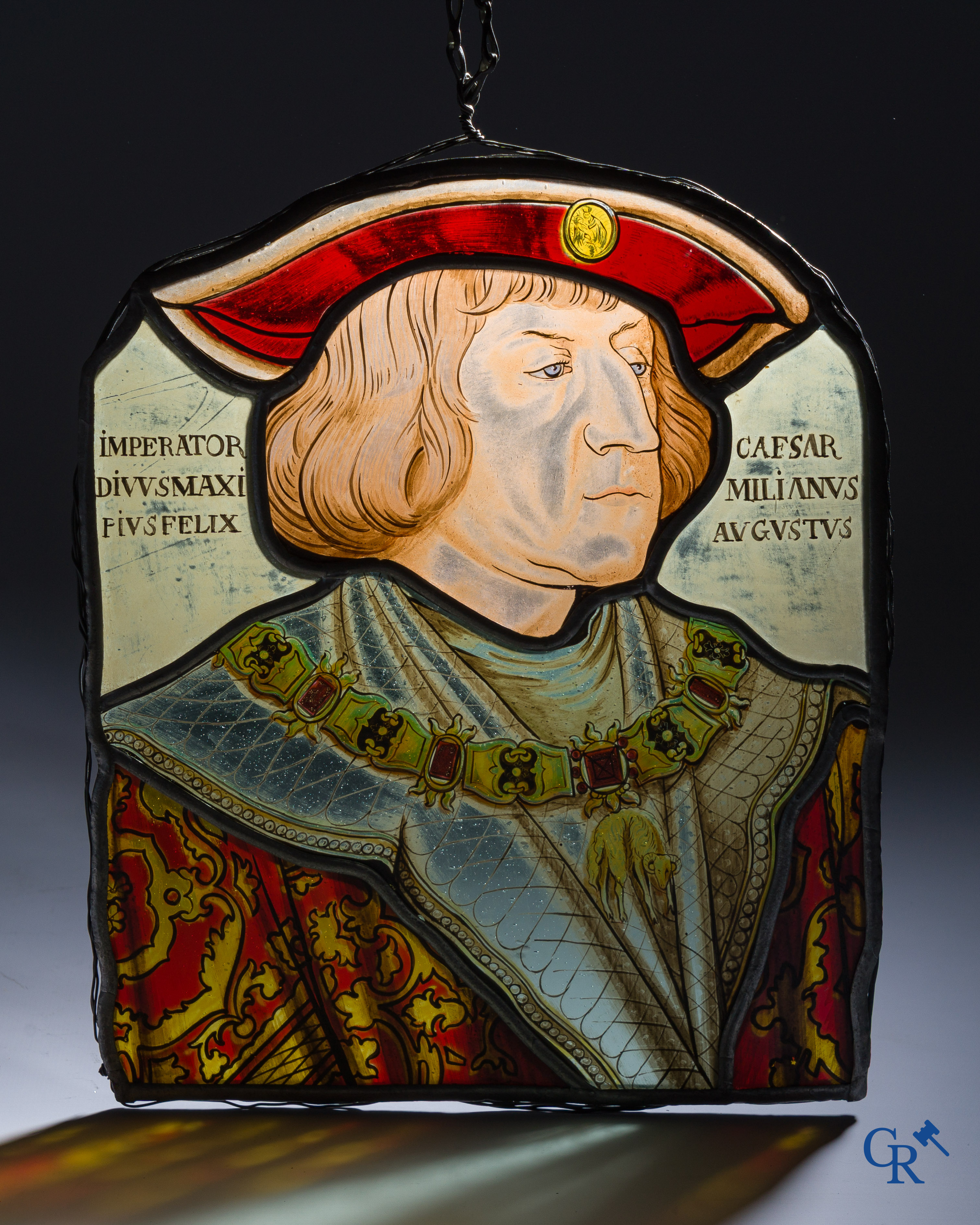 A fragment of an antique stained glass with the portrait of Maximilian I of Austria.