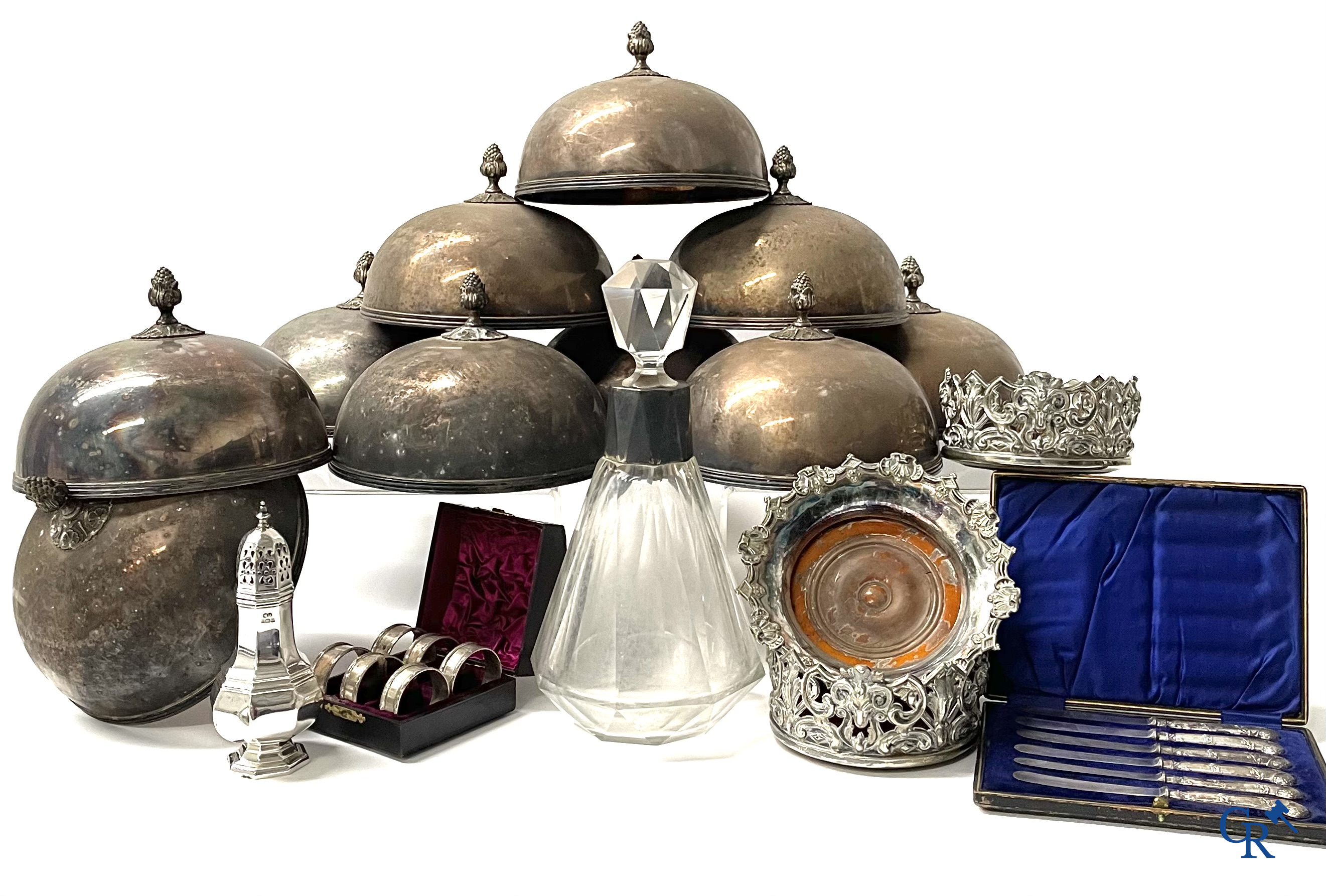 A set of 10 silver-plated metal table bells, a carafe with silver frame, silver napkin rings, a sprinkler bus, etc.