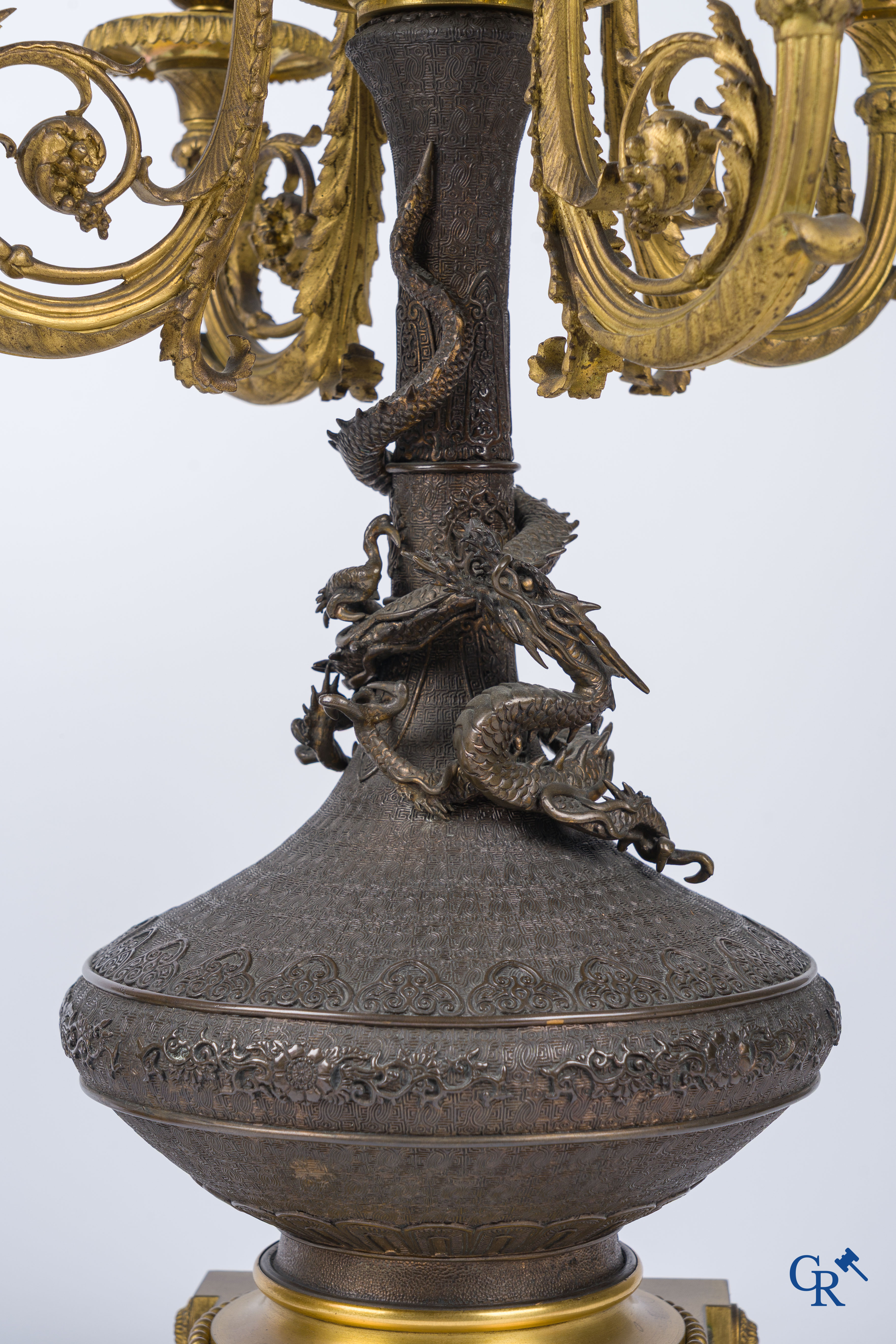 Asian Art, A pair of bronze candlesticks with finely crafted Oriental vases with dragons, circa 1880.