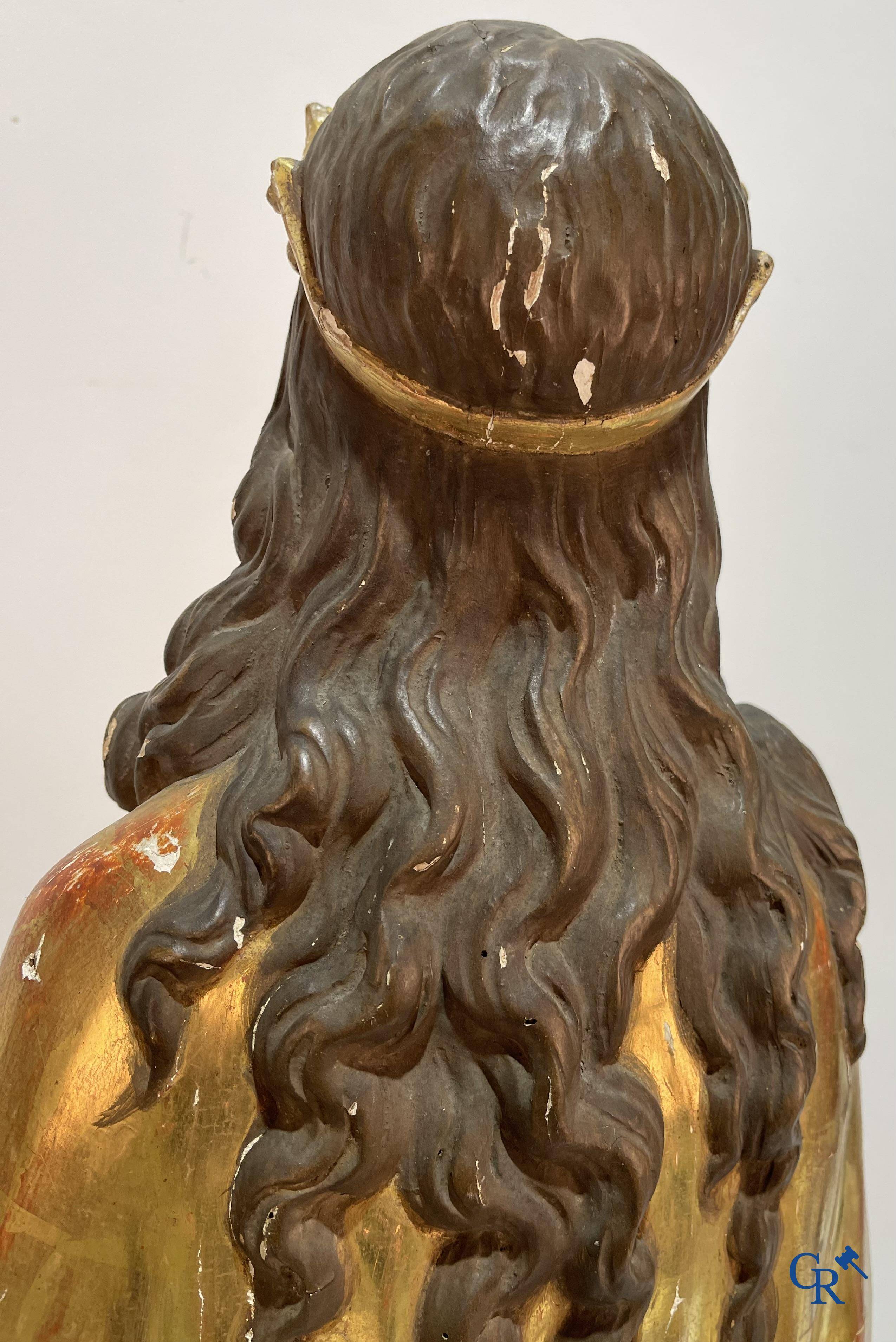 A large gilded and polychrome wooden statue of Saint Catherine of Alexandria.