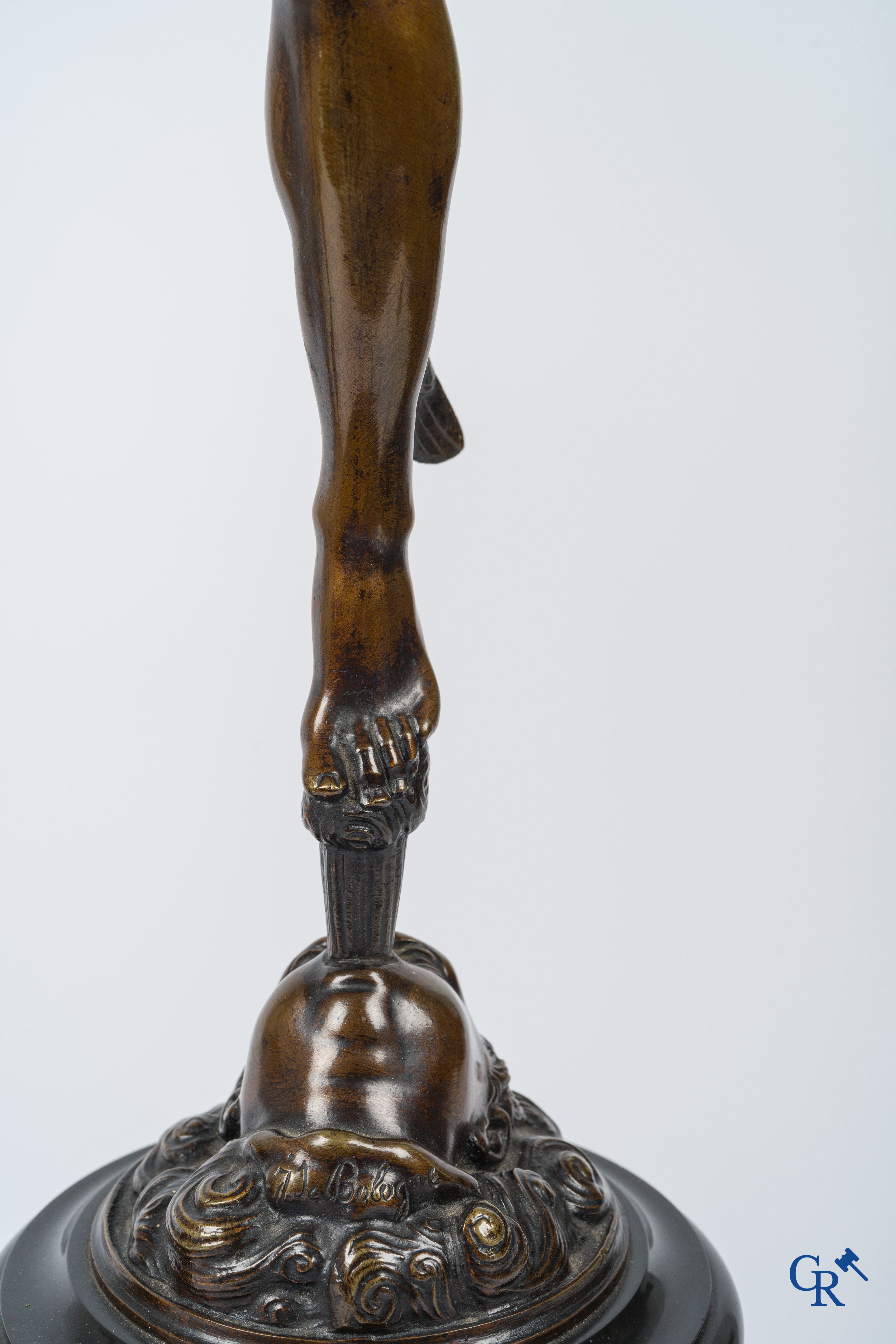 A pair of imposing bronze statues in the antique style after a model by Jean De Bologne.