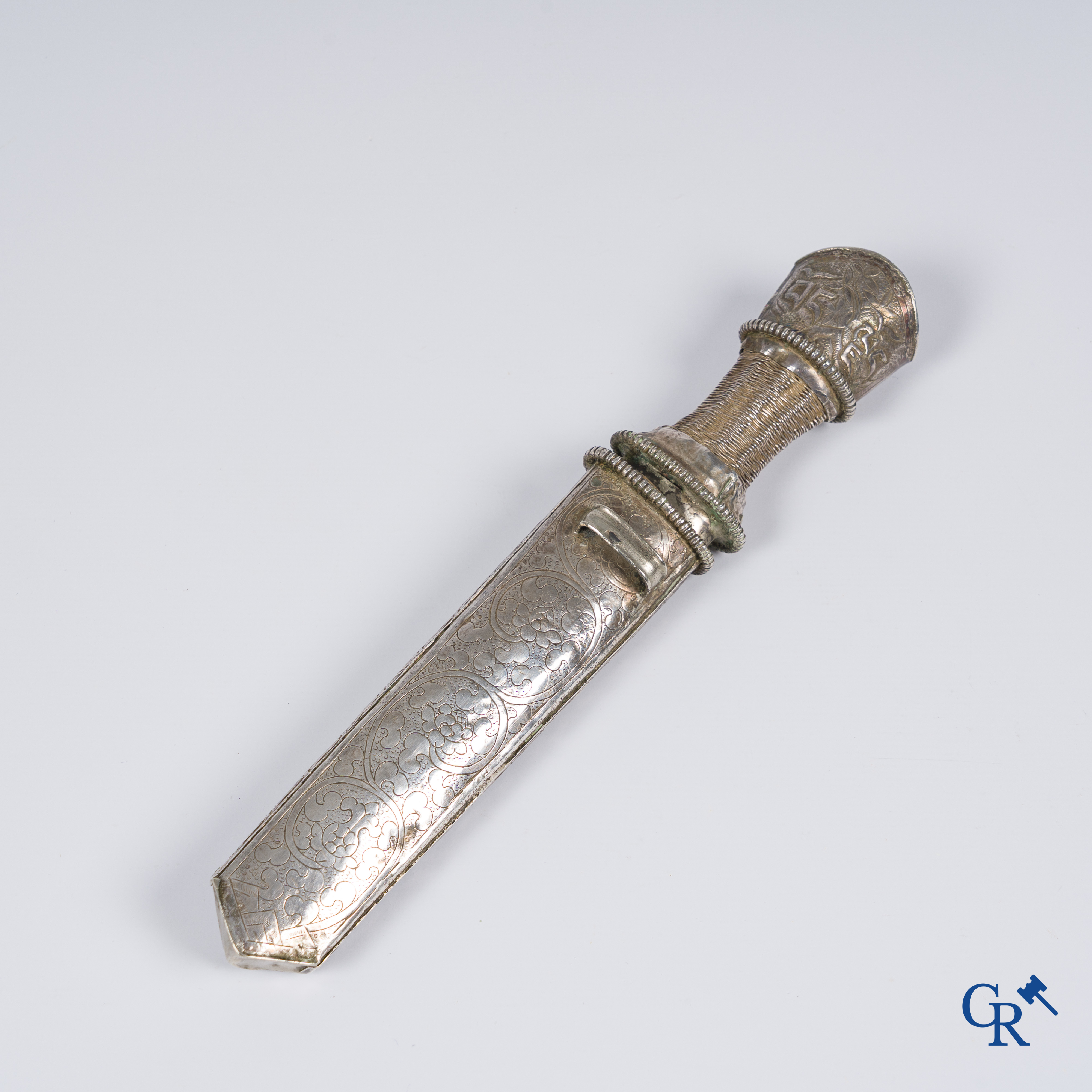 Asian Art, a richly carved silver Tibetan dagger with dragon motif. 19th century.
