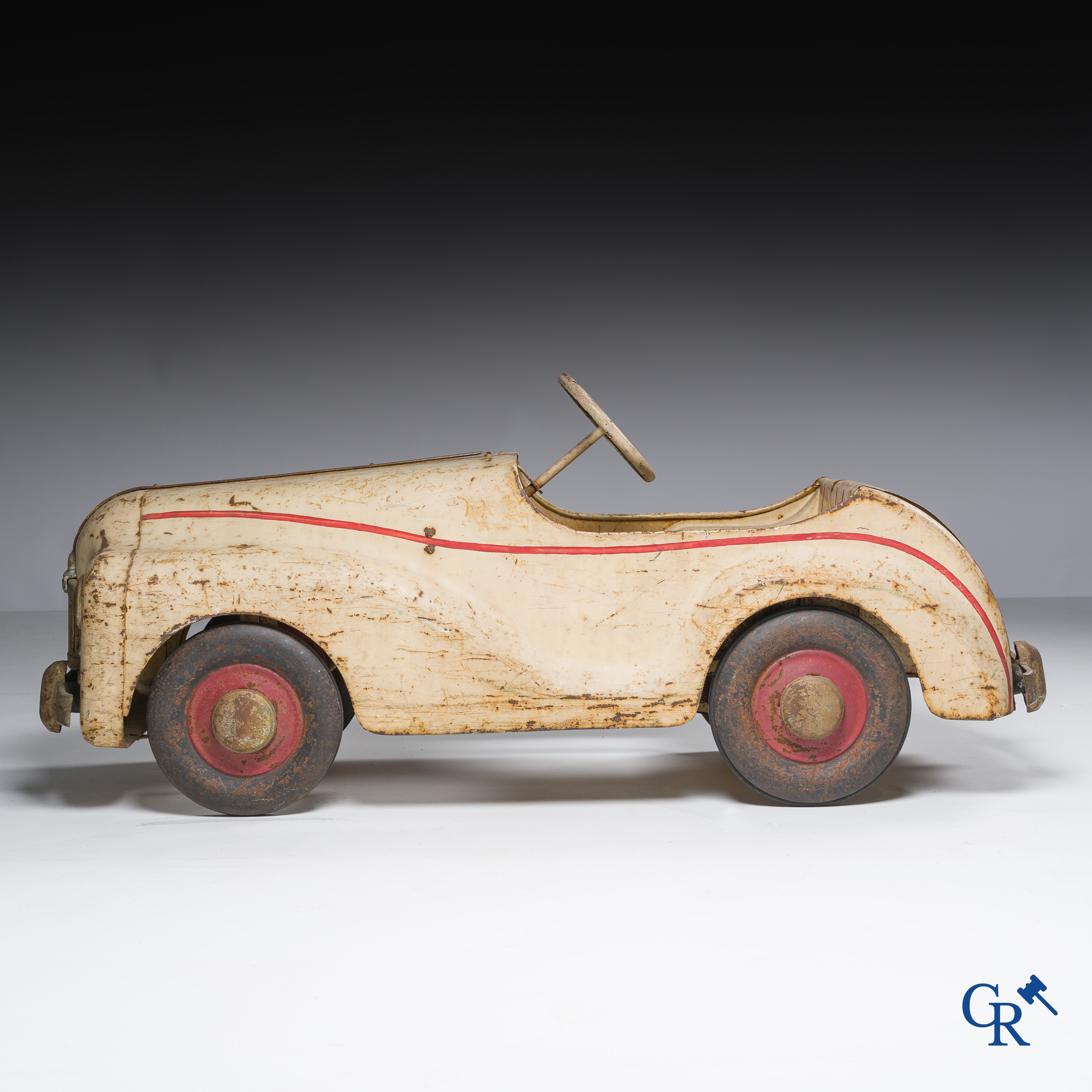 Tri-Ang. Metal pedal car in original condition. Circa 1950.