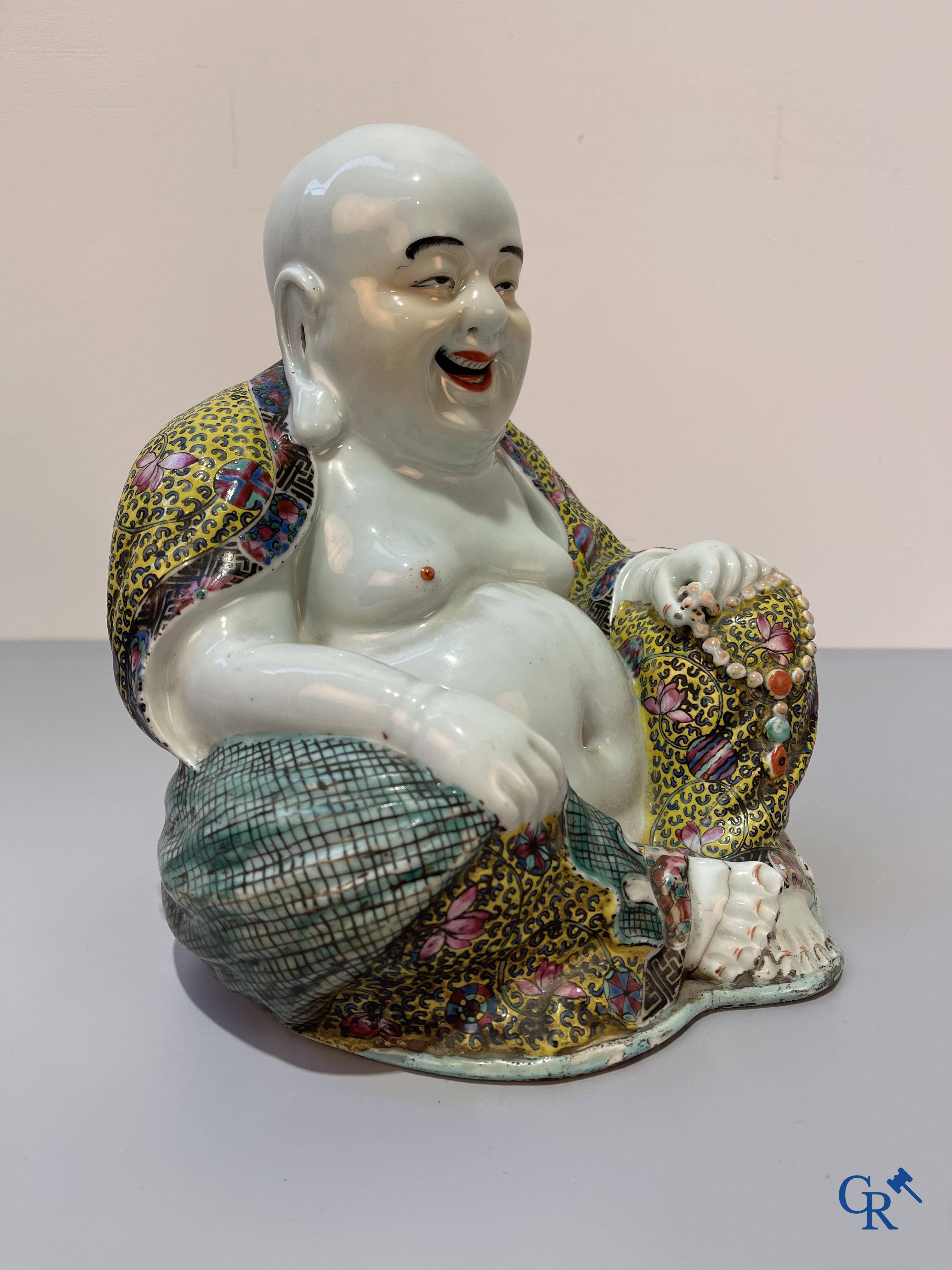 Asian Art, Chinese porcelain. A Chinese famille rose figure of a Buddha with a seal mark. 19th century.