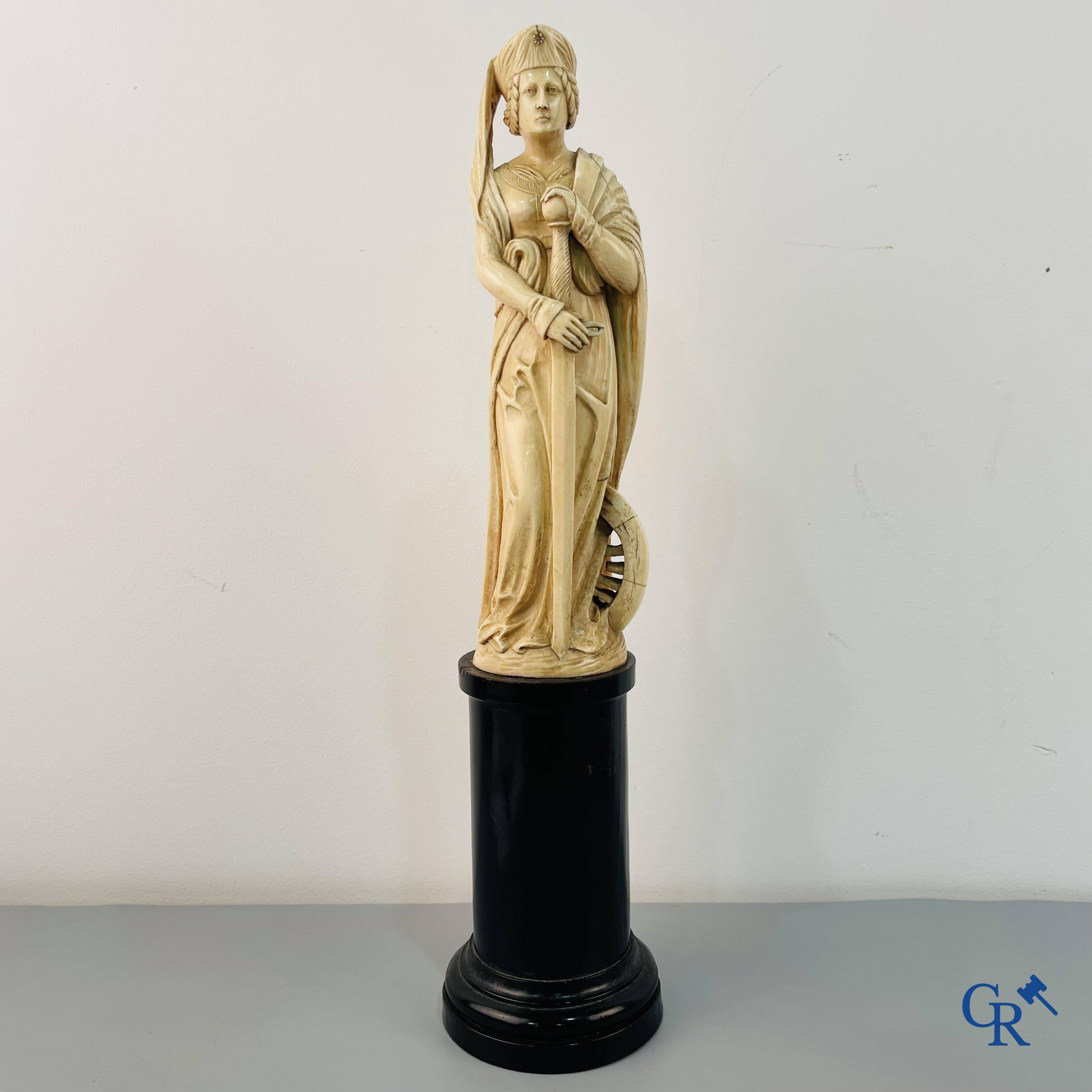 Dieppe, French work, early 19th century. Representation of Catherine of Alexandria in ivory on a pedestal.