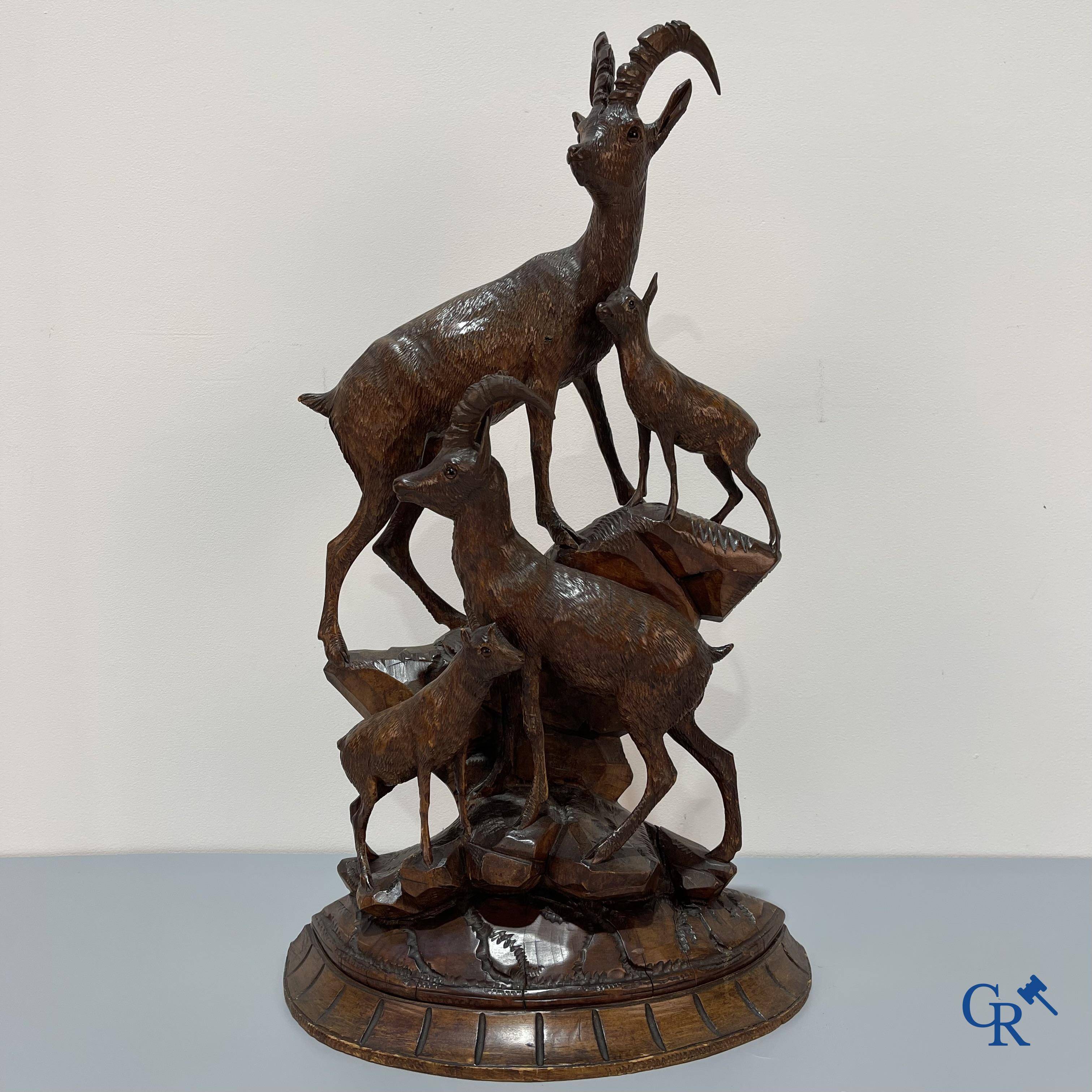 A Black Forest wood sculpture with capricorns, Germany circa 1900.