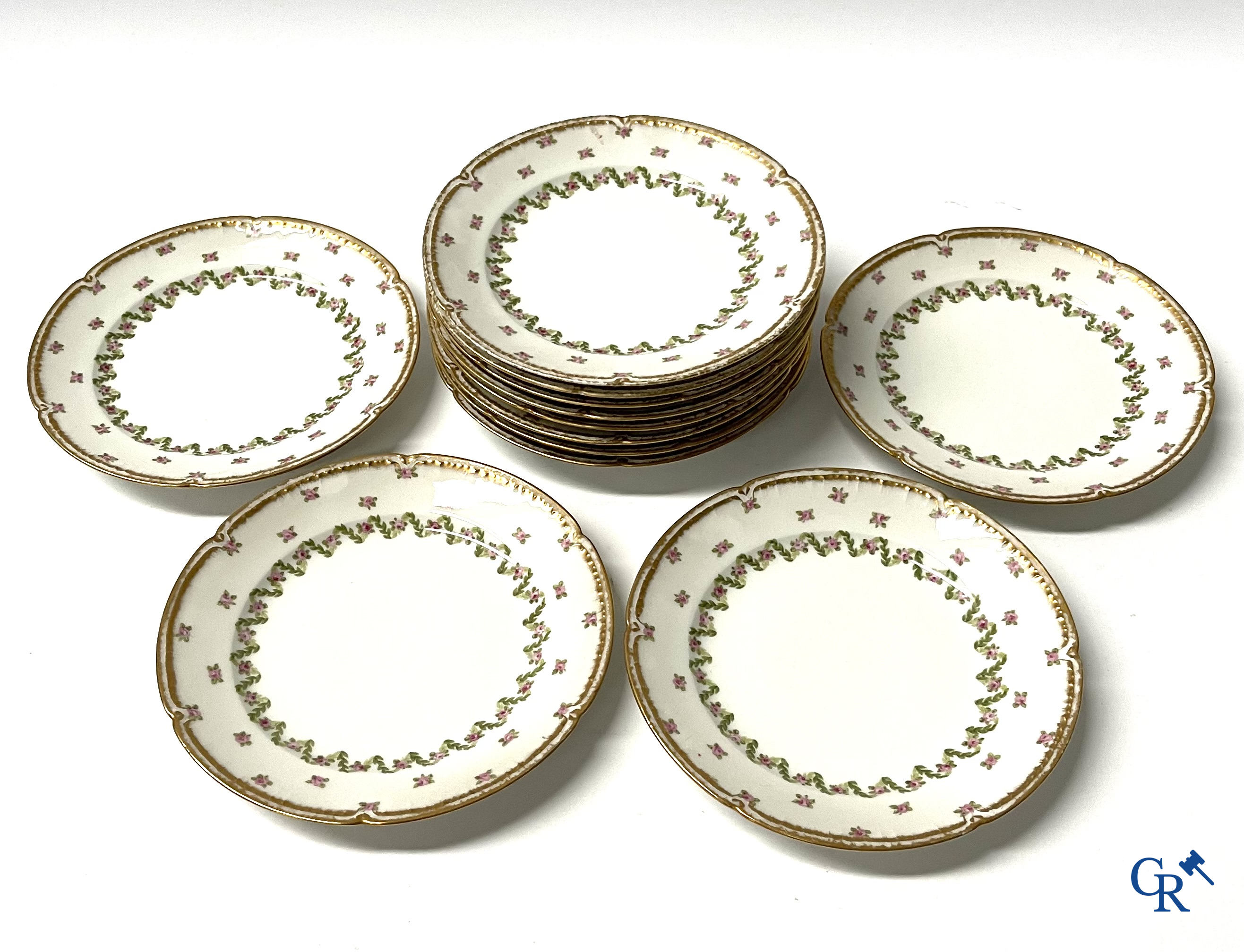 A coffee and tea set with 12 dessert plates in gilded and polychrome decorated French porcelain. Around 1900.