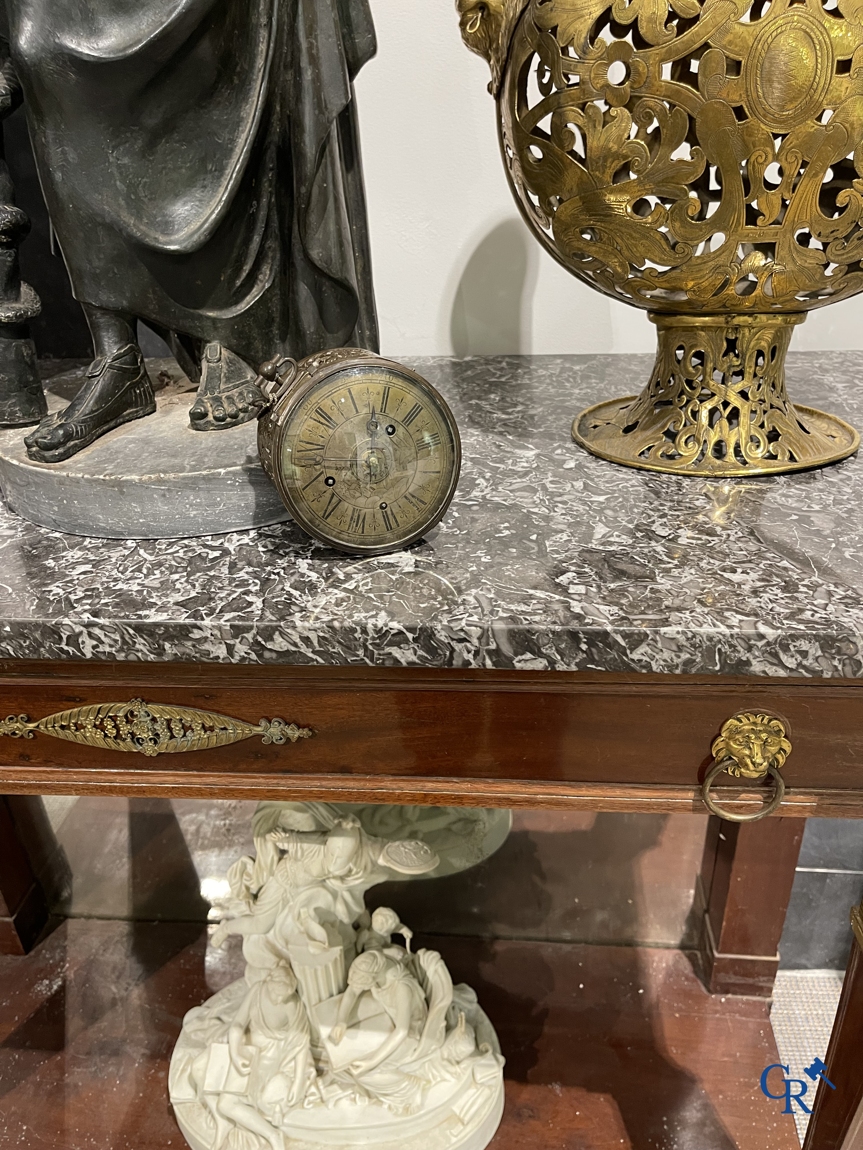 Clocks and watches. Montre de carosse. Large carriage watch with engraved and perforated case. France 17th century.