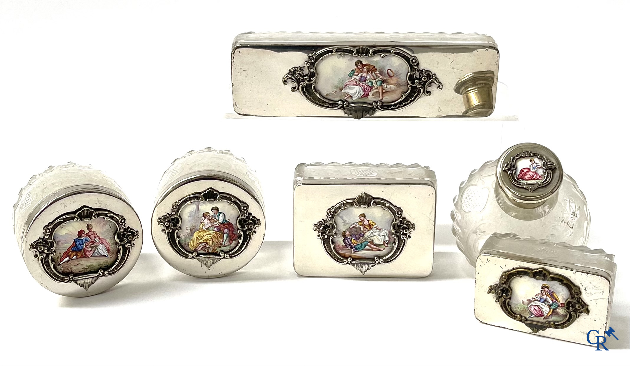 A seven-piece toilet set in silver-plated metal, finely cut crystal and enamelled plaques.