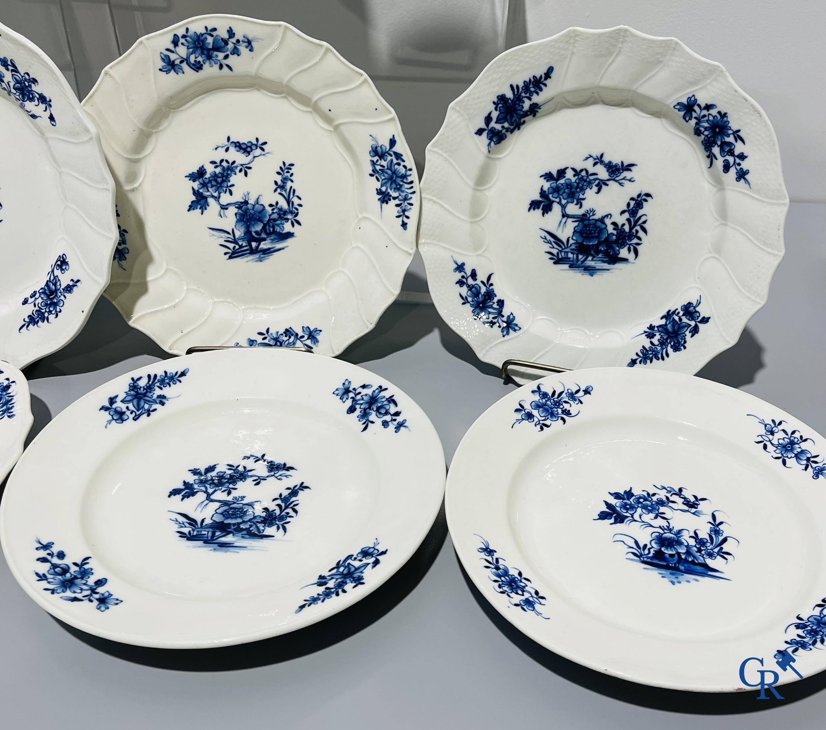 European porcelain, Tournai. 13 plates with blue decor and a large monochrome dish. 18th century.