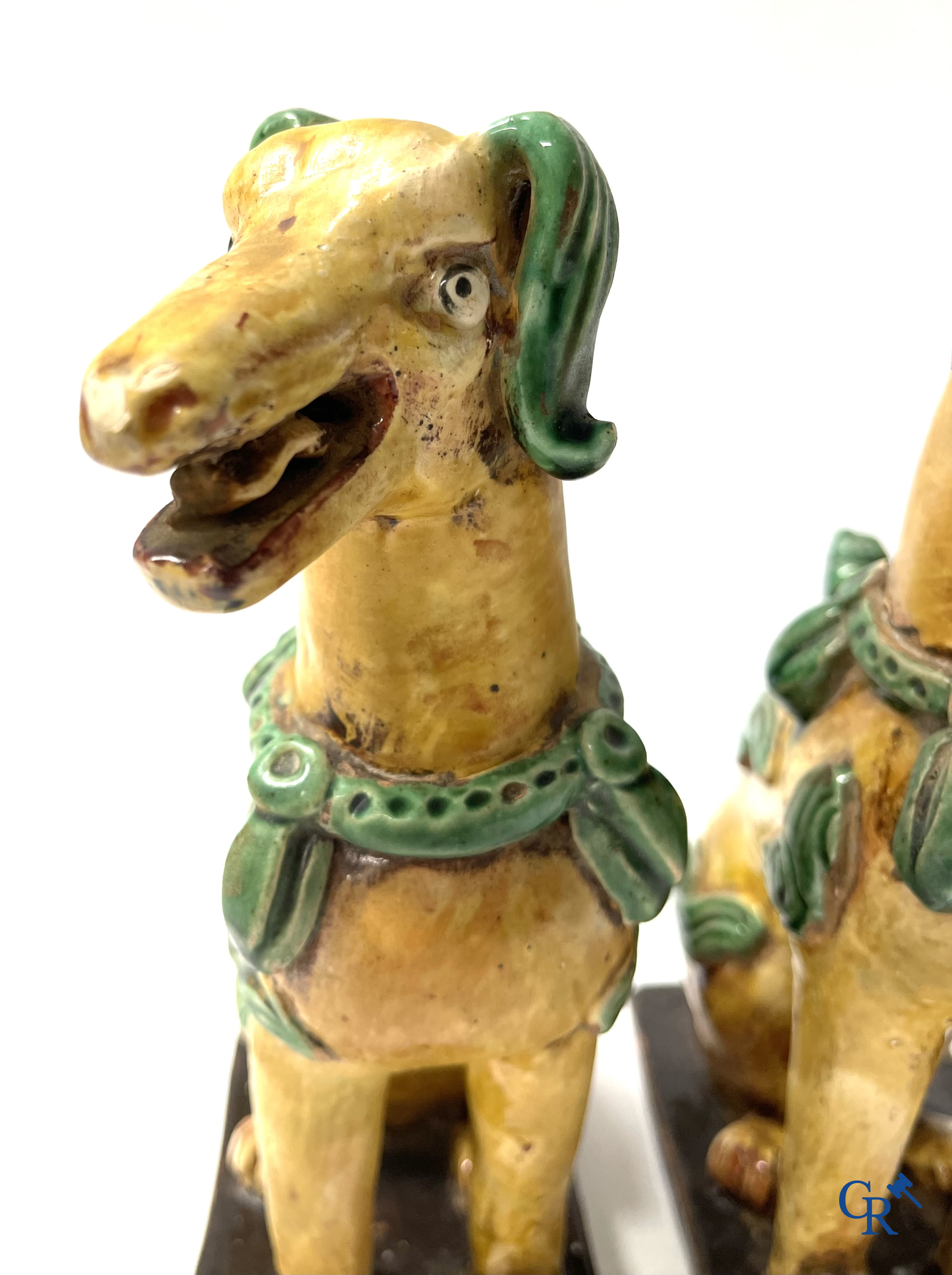 Asian Art, Chine. A pair of seated enamelled terra cotta dogs.