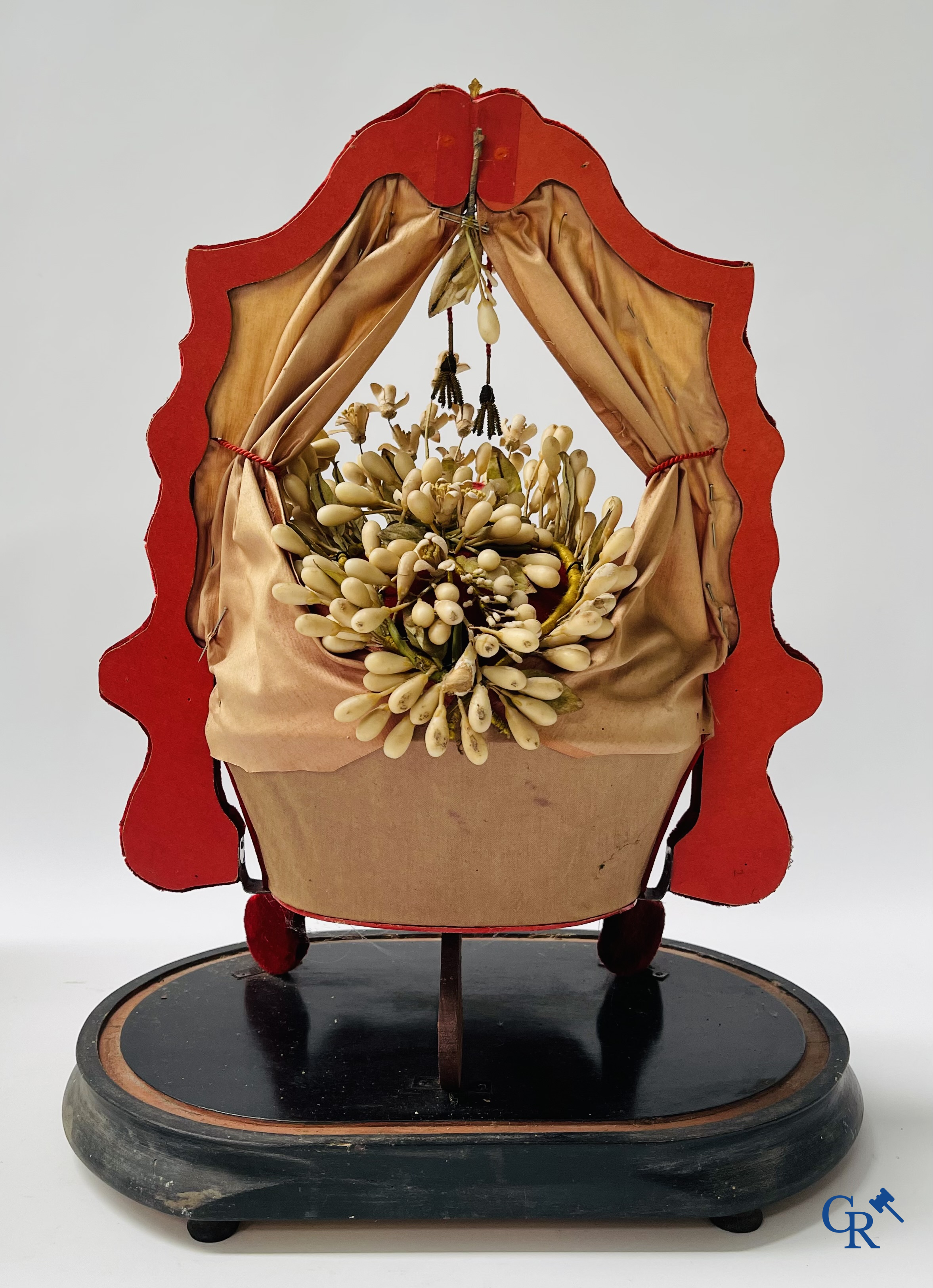 2 glass domes with a bridal bouquet on a base decorated with ornaments in gilded brass. circa 1900.