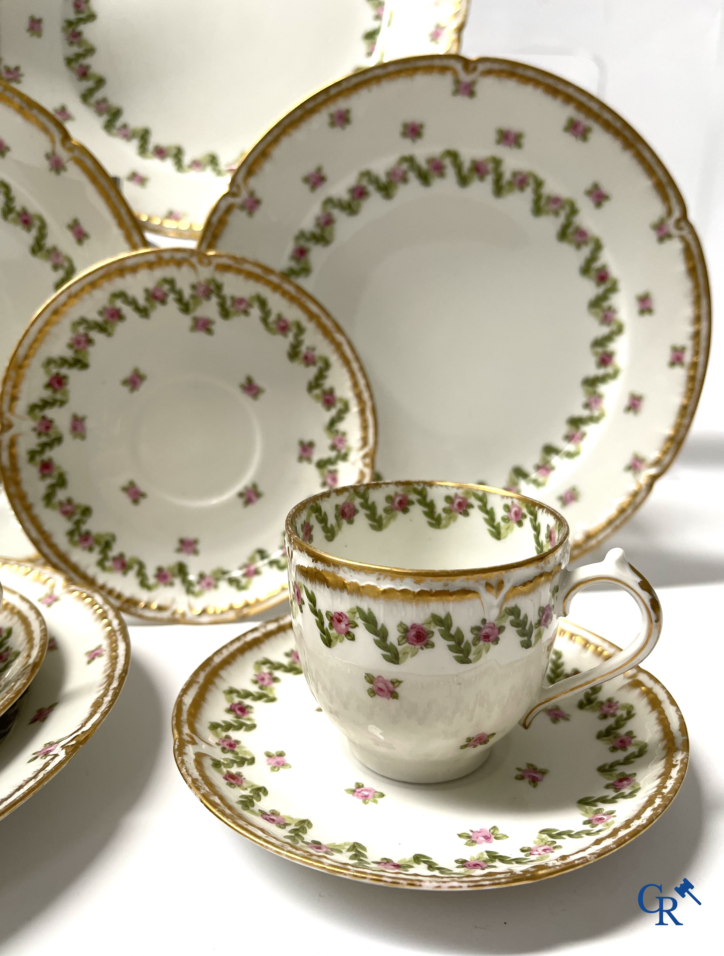 A coffee and tea set with 12 dessert plates in gilded and polychrome decorated French porcelain. Around 1900.