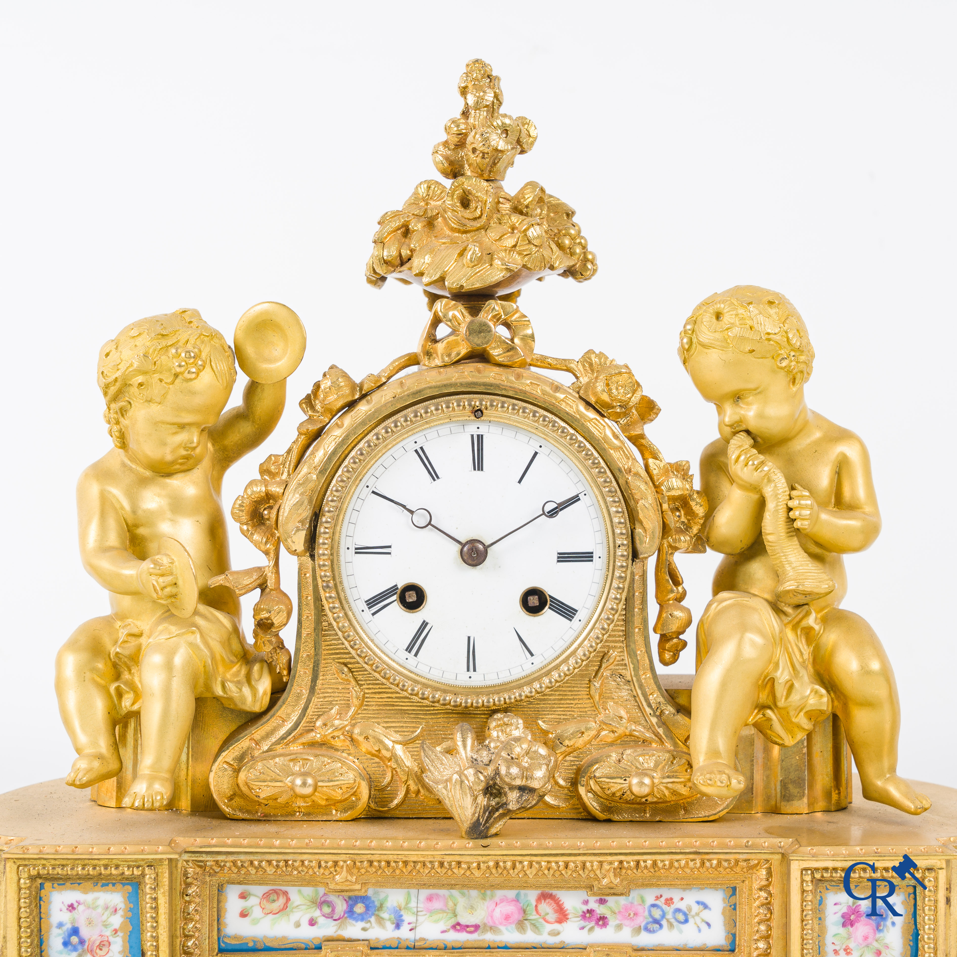 A 3-piece gilded bronze fireplace clockset with Sèvres porcelain.