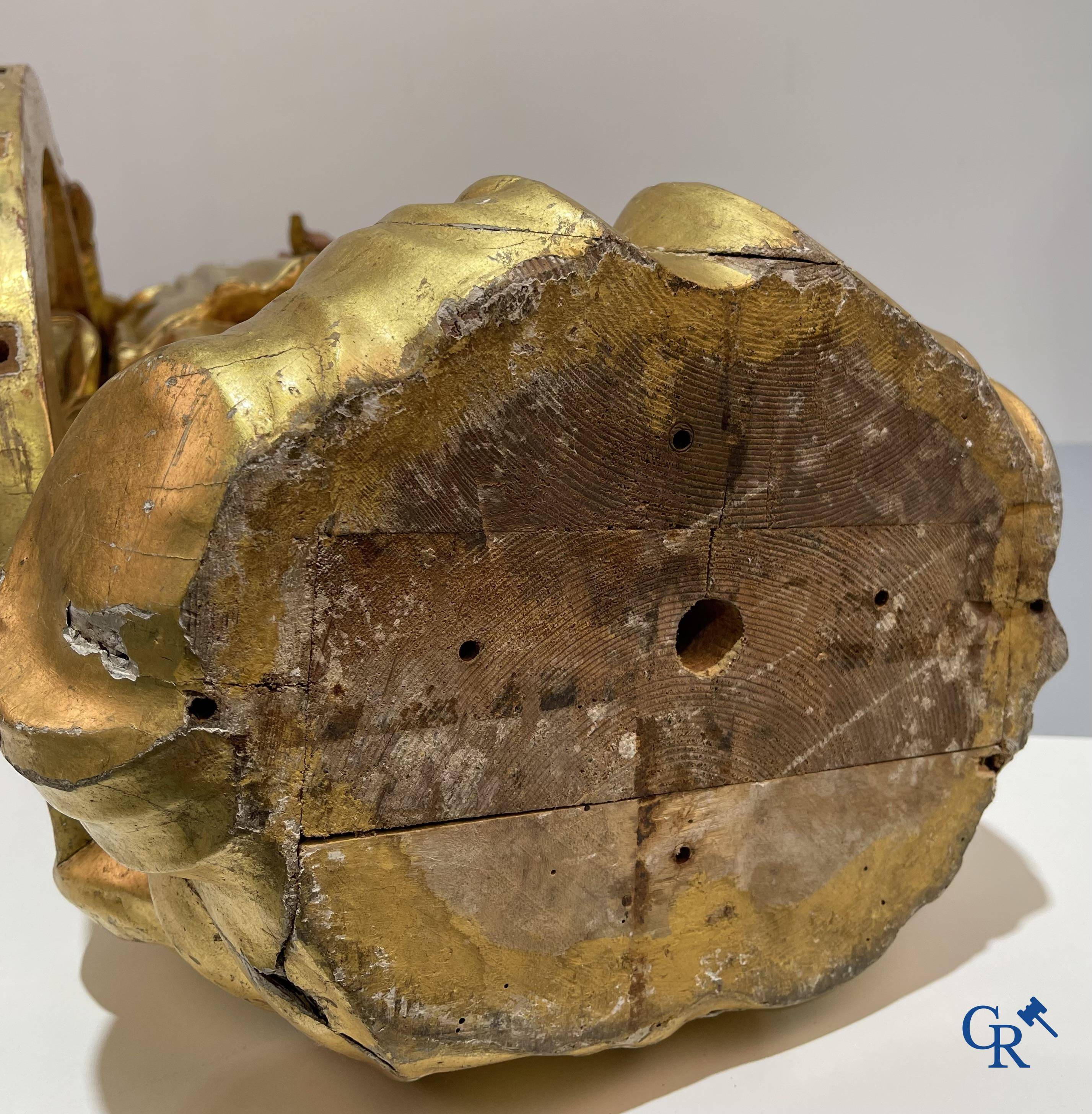 A large gilded and polychrome wooden statue of Saint Catherine of Alexandria.