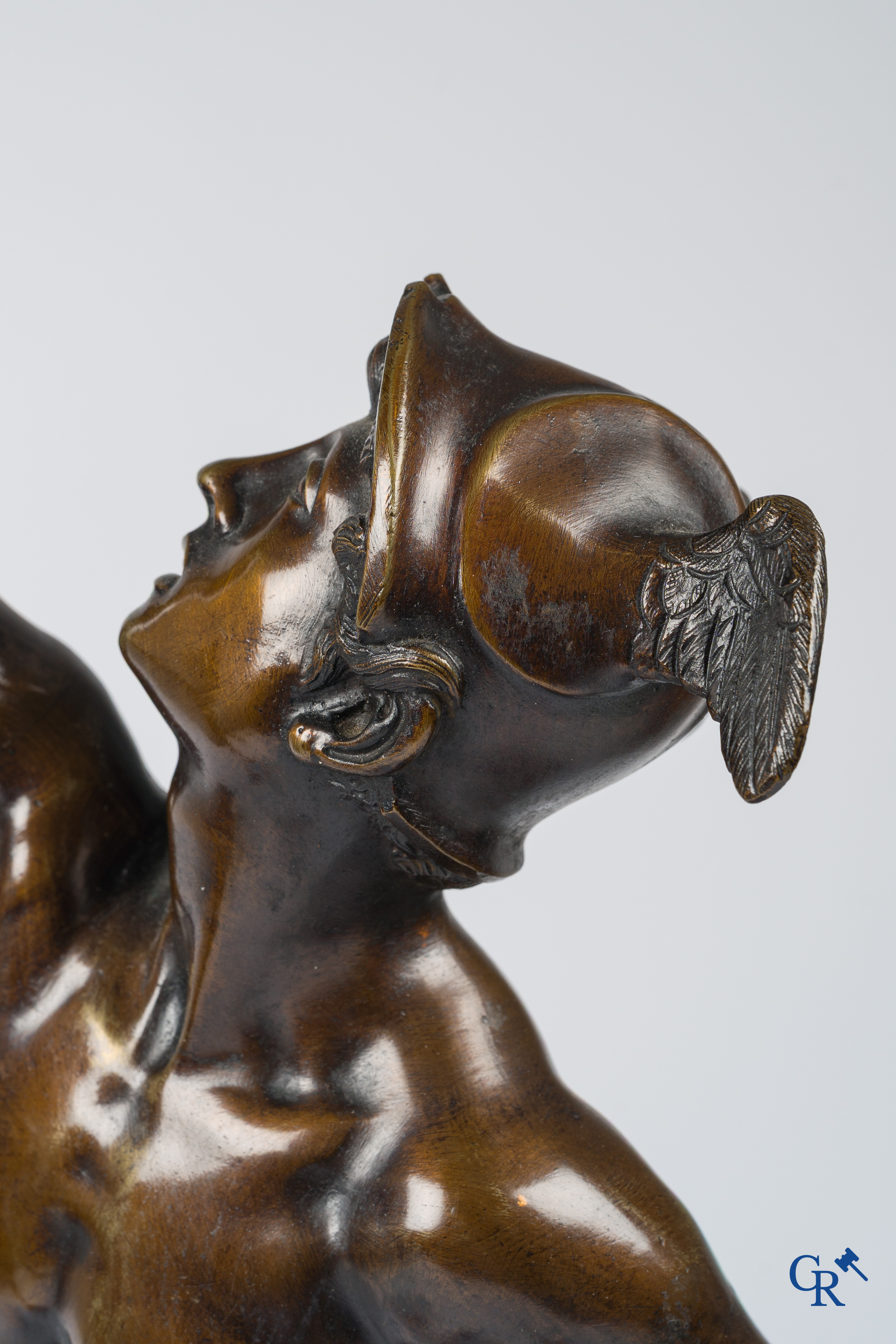 A pair of imposing bronze statues in the antique style after a model by Jean De Bologne.