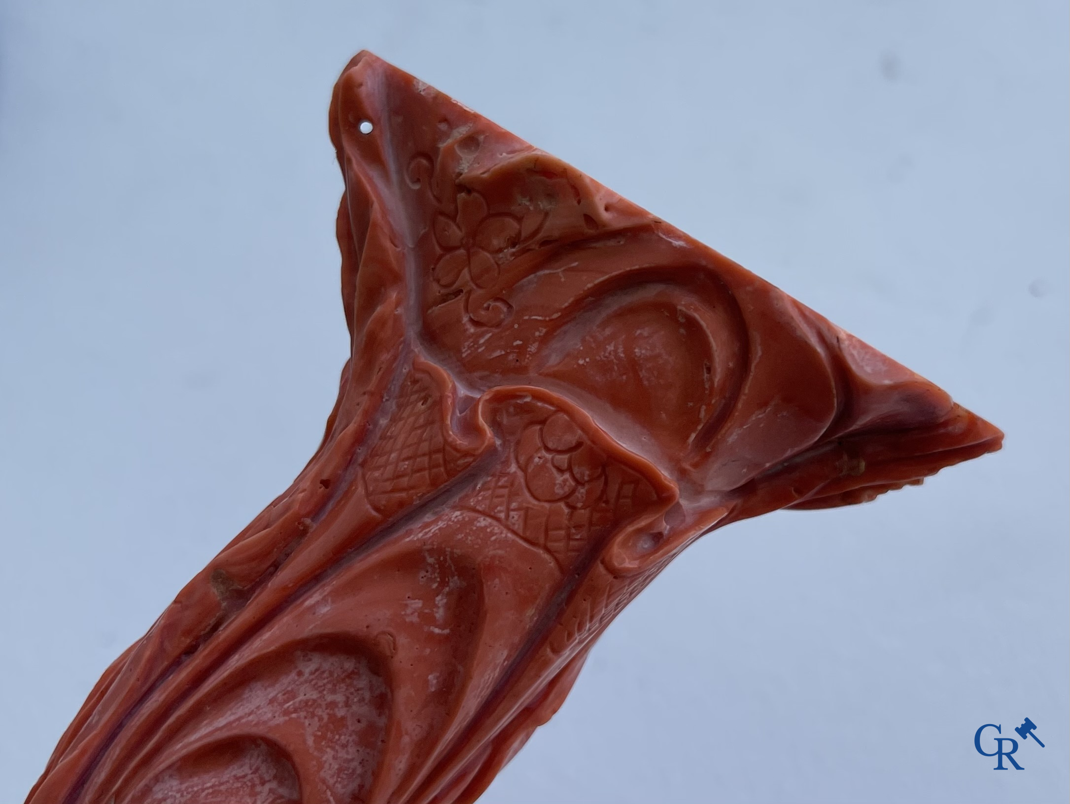Asian Art, China. A red coral figure of a Chinese lady on a wooden pedestal.