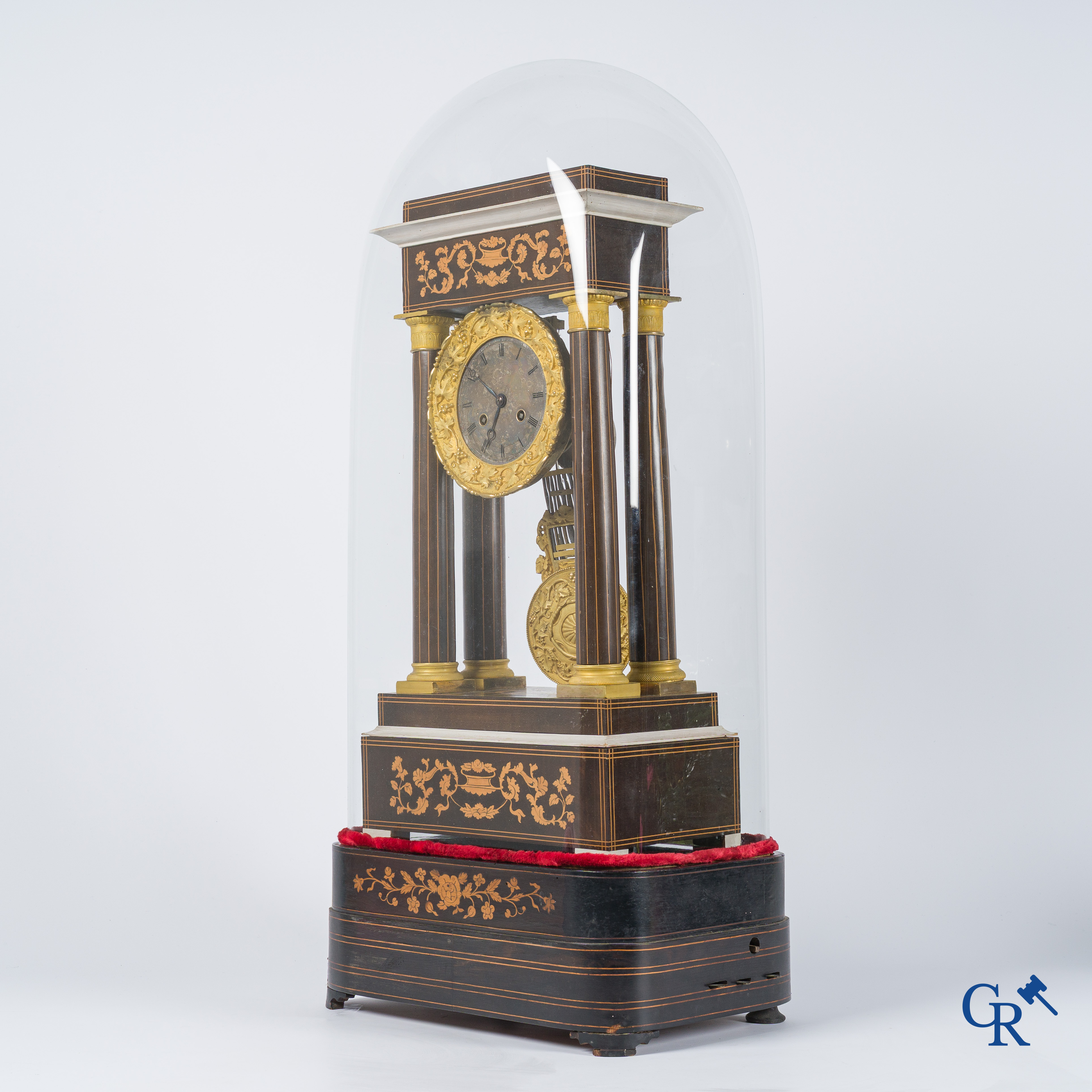 Charles X column pendule in marquetry and bronze with music box. Matching globe. 19th century.