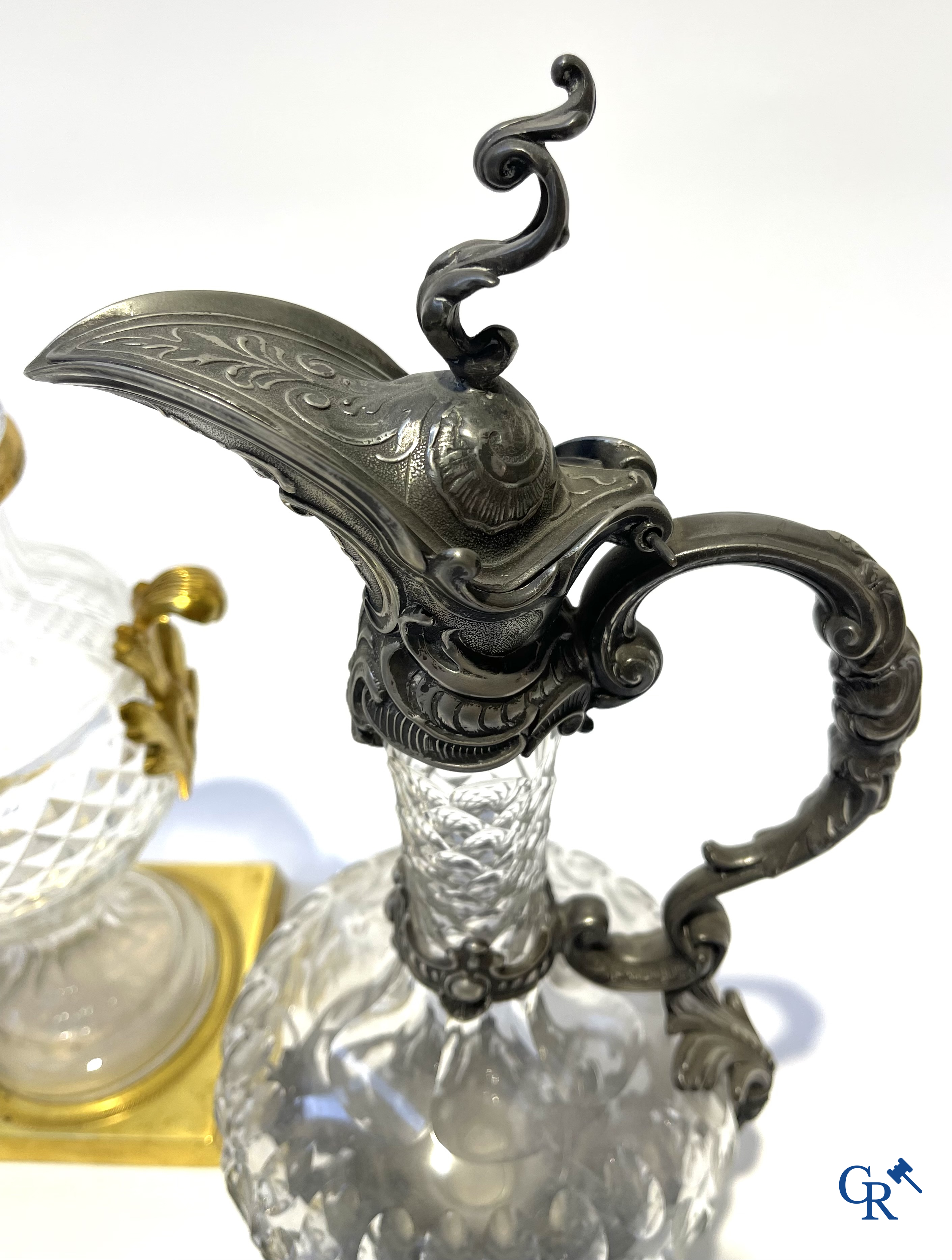 A lot of 2 decanters in crystal, an ink set in silver 800°/00 and a lid vase.