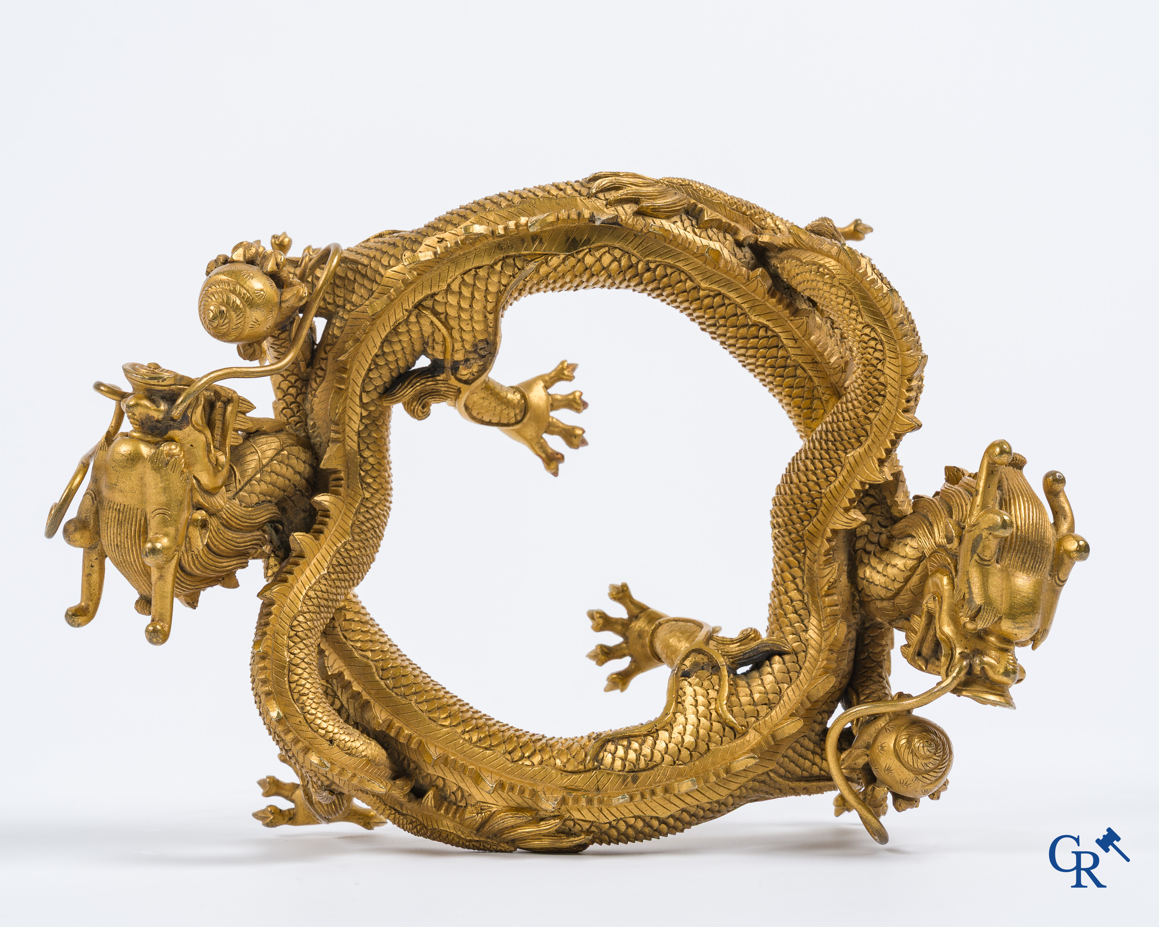 Asian Art. China. A rare Chinese gilt-bronze dragon stand. Qing Dynasty.