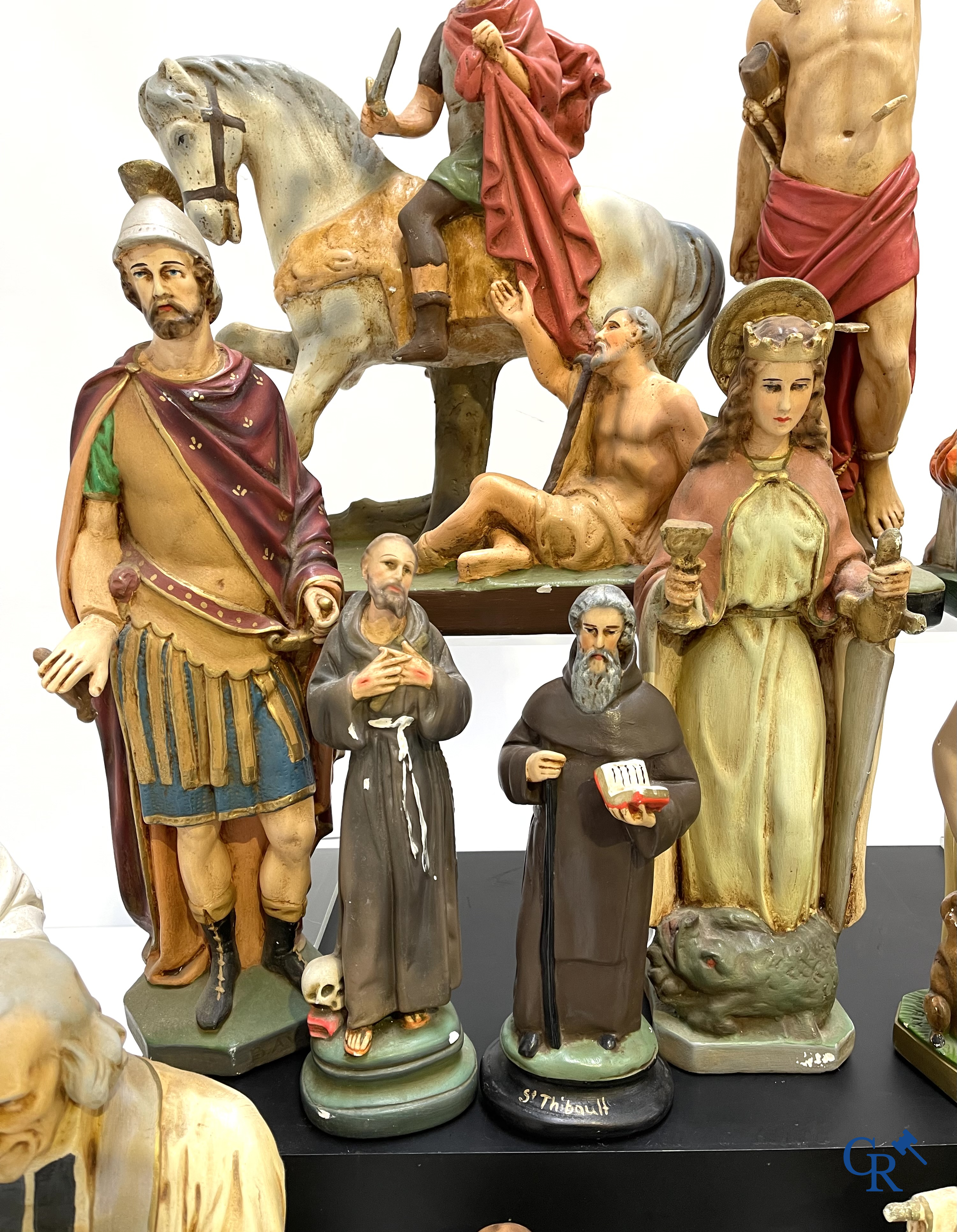 Religious objects. Large lot of various statues of saints in plaster.