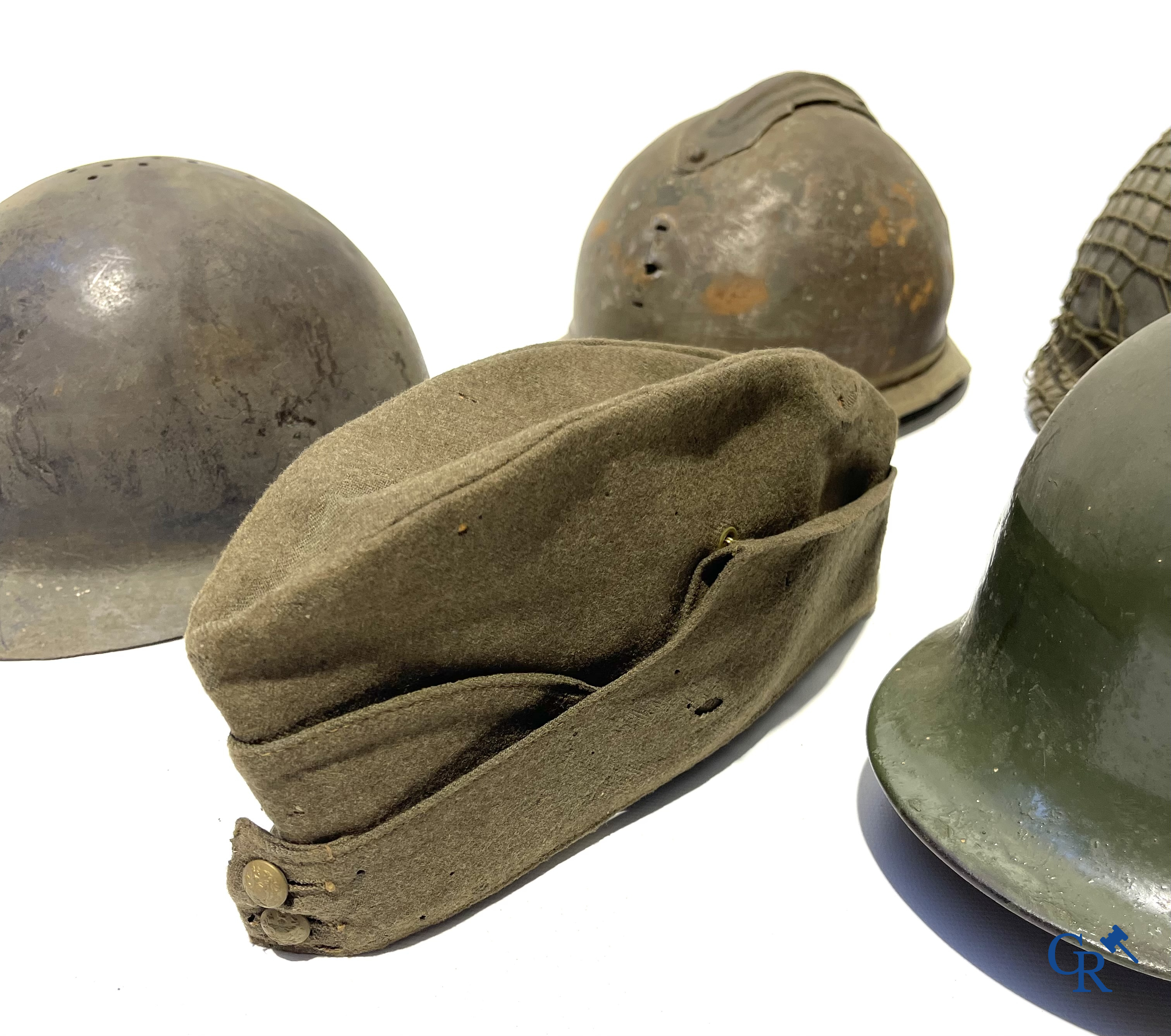 Militaria. Lot of 5 military headgear, some WWII including an officers cap from The Headline Hat Co., 1941.