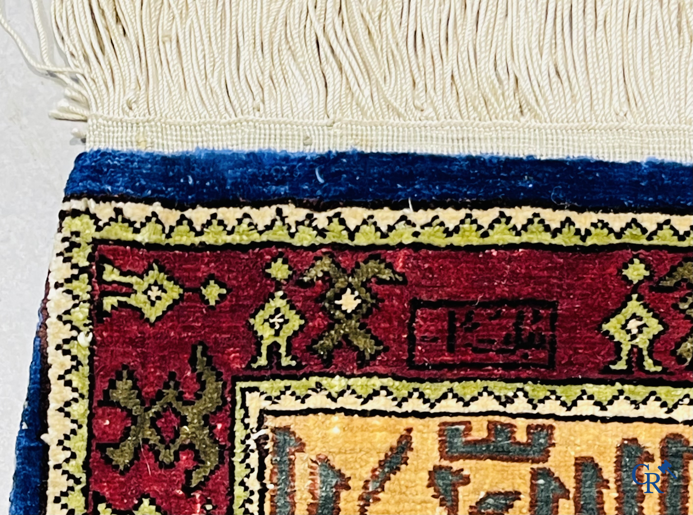 Oriental carpets. Extremely finely hand knotted silk carpet with inscriptions and gold thread. Signed.