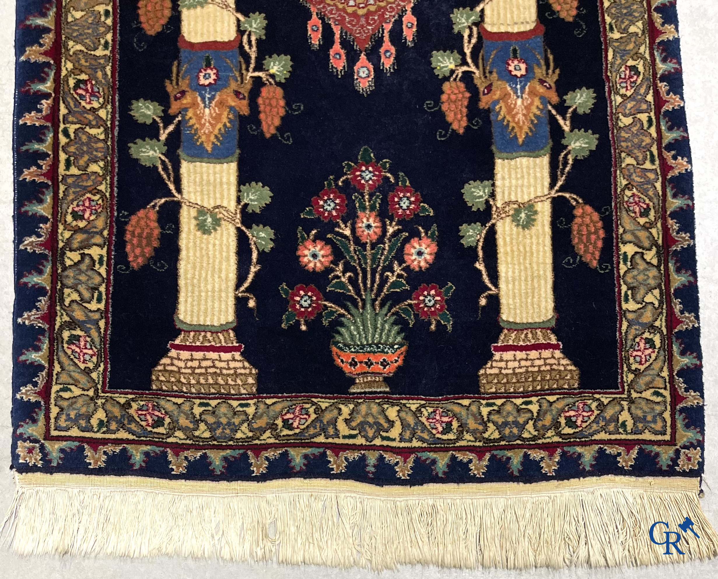 Oriental carpets. A wool prayer carpet.