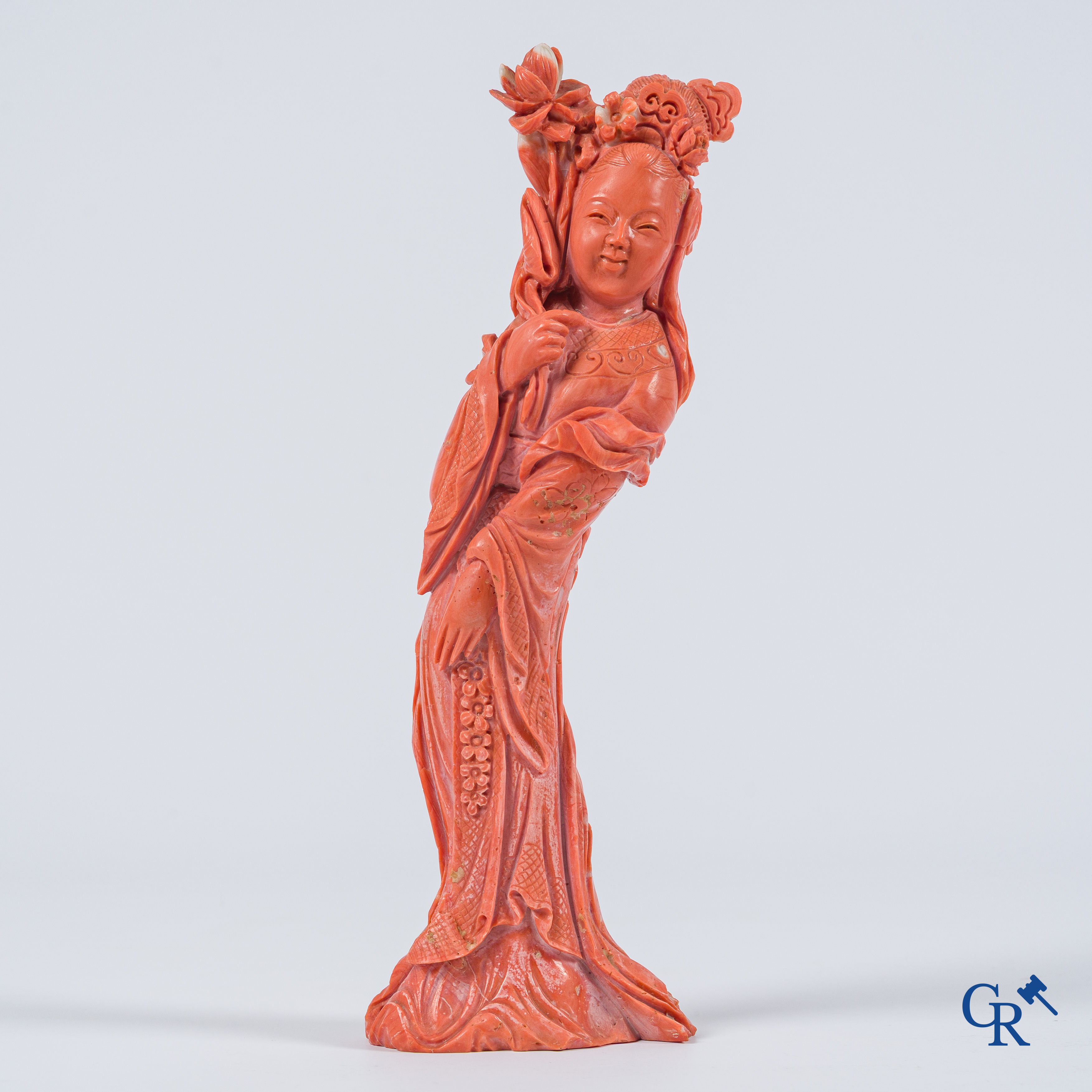 Asian Art, China. A red coral figure of a Chinese lady on a wooden pedestal.