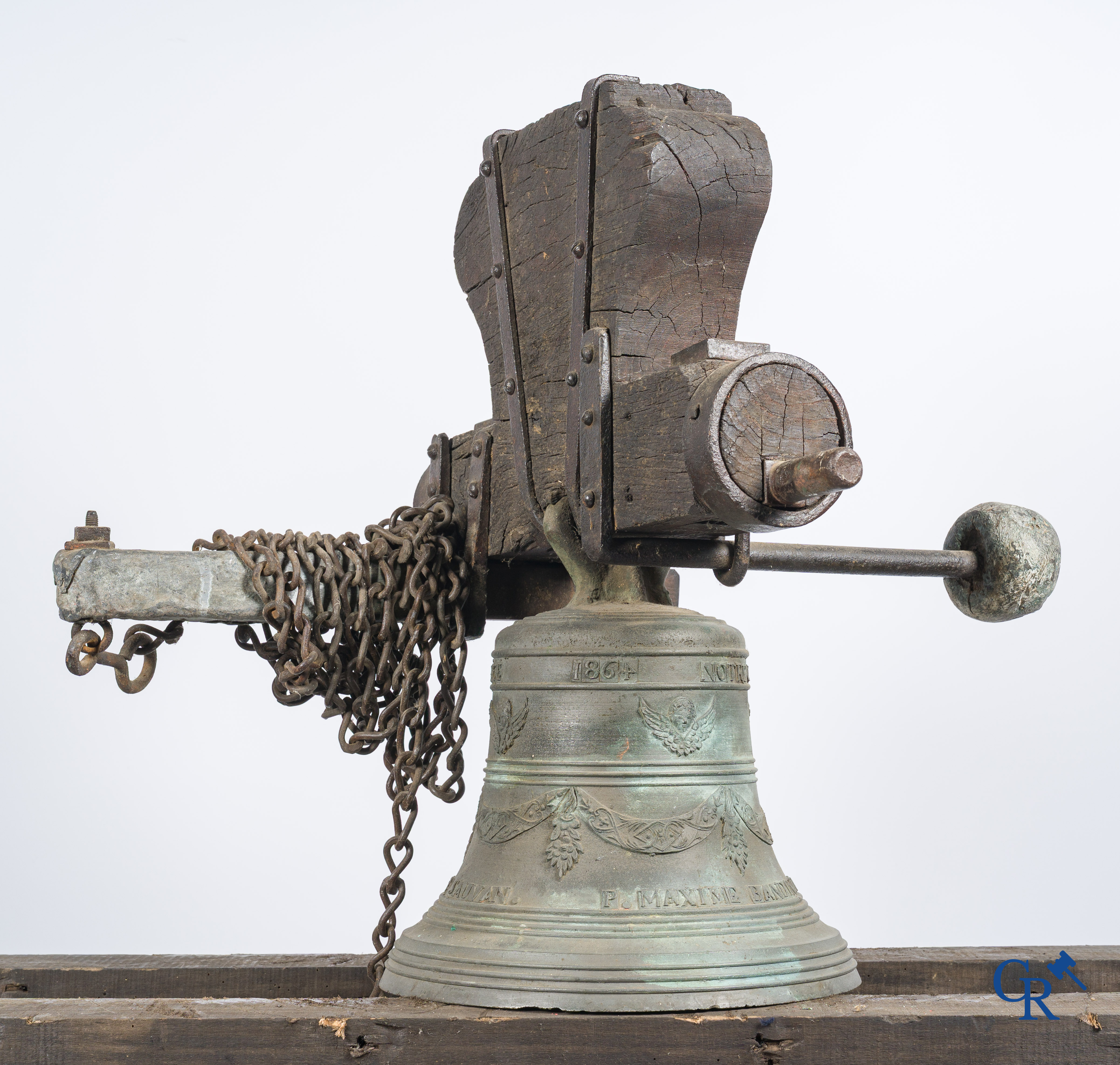 Large bronze bell with wooden yoke. Decorated with winged angels and garlands. Inscription band. Nice 1864.