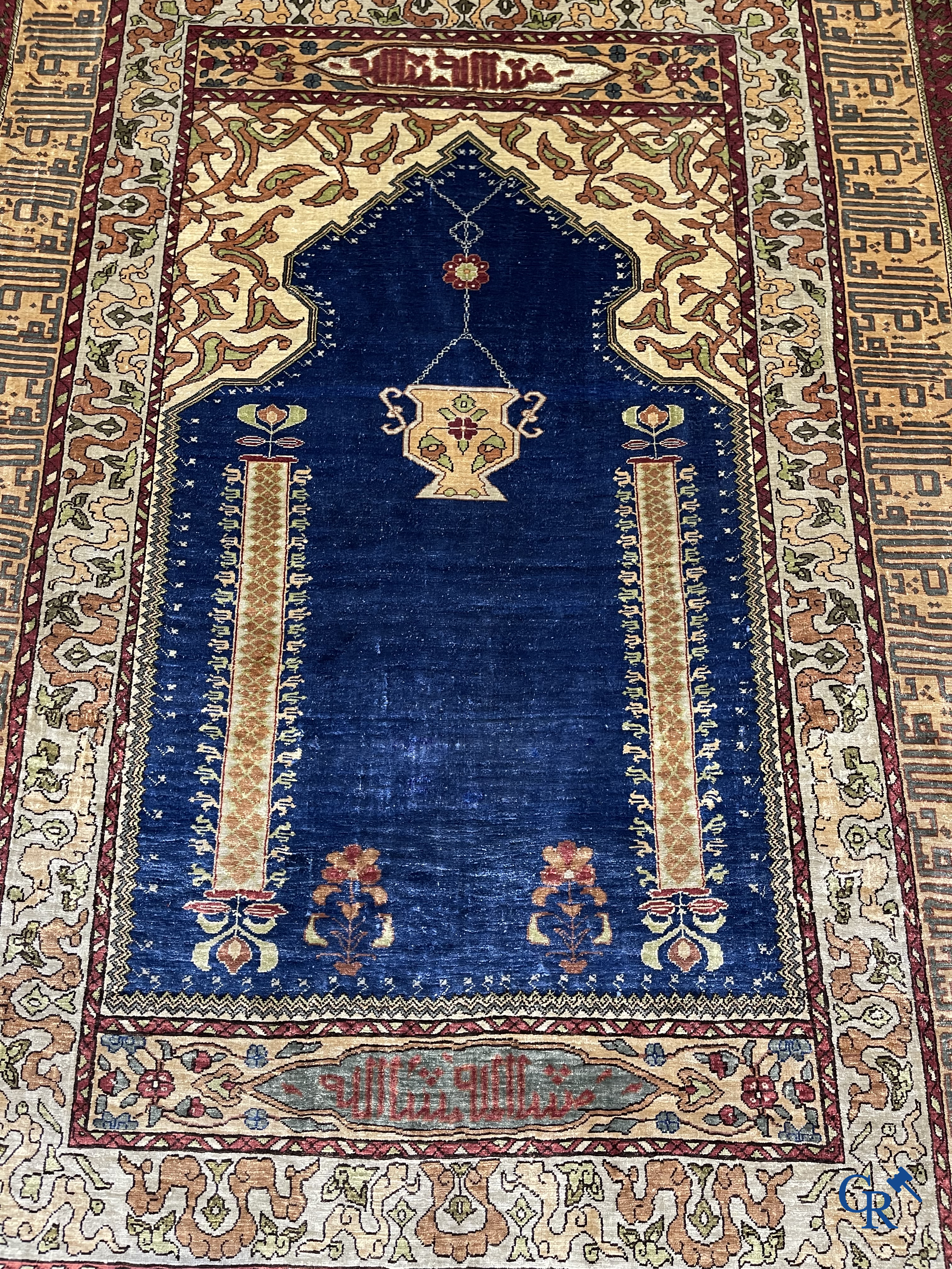 Oriental carpets. Extremely finely hand knotted silk carpet with inscriptions and gold thread. Signed.