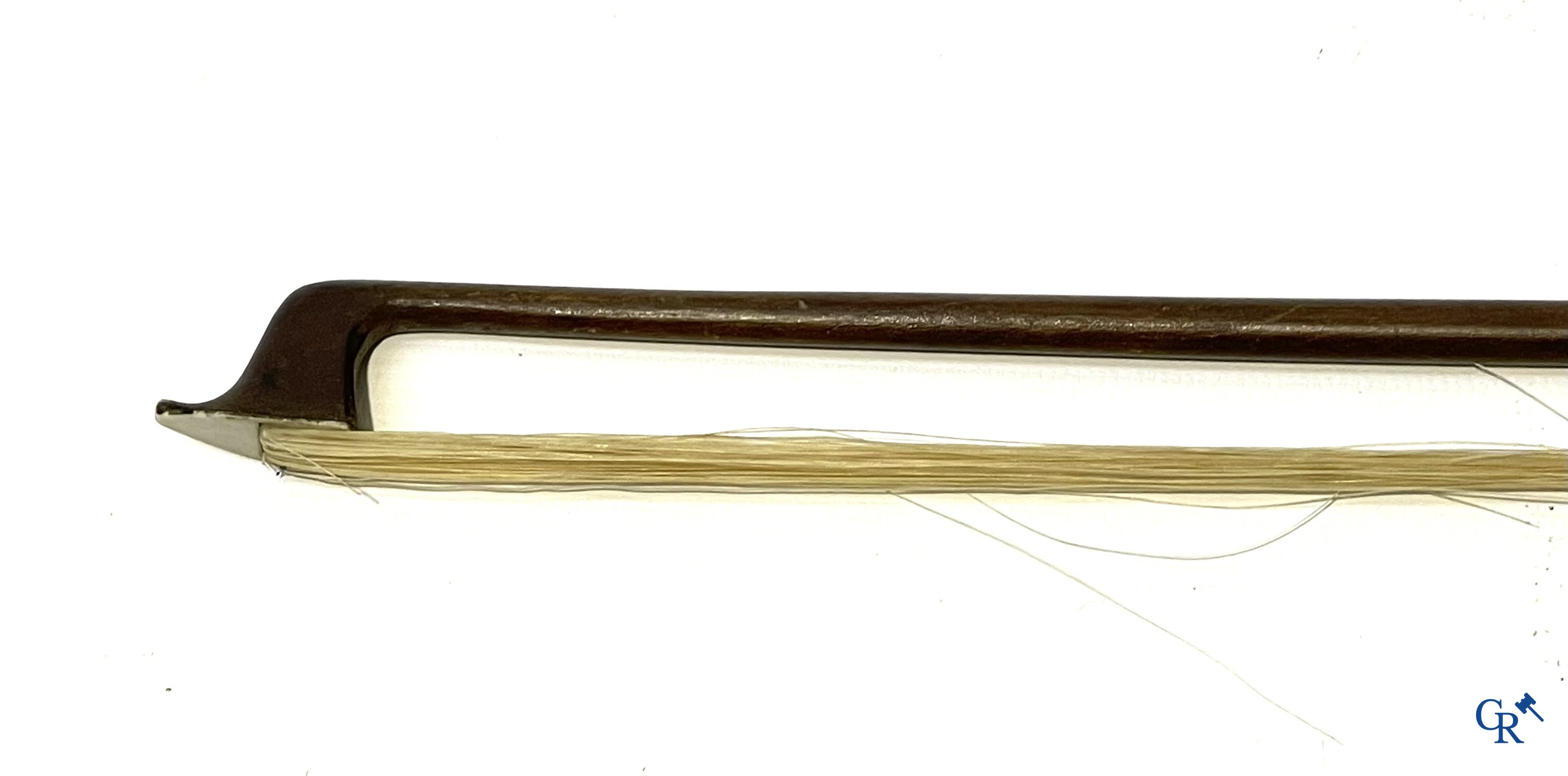 Antique violin with bow in storage case.