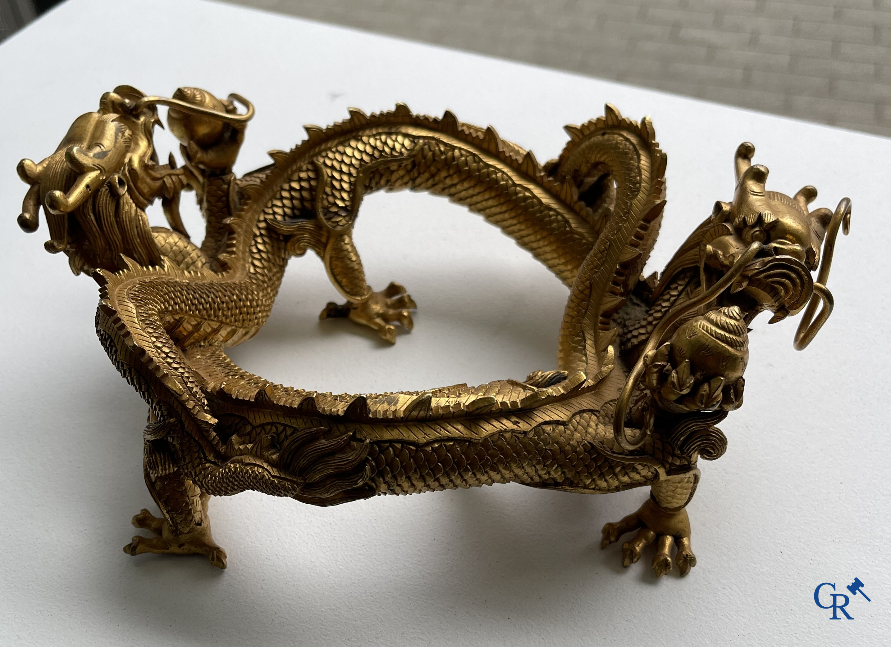 Asian Art. China. A rare Chinese gilt-bronze dragon stand. Qing Dynasty.