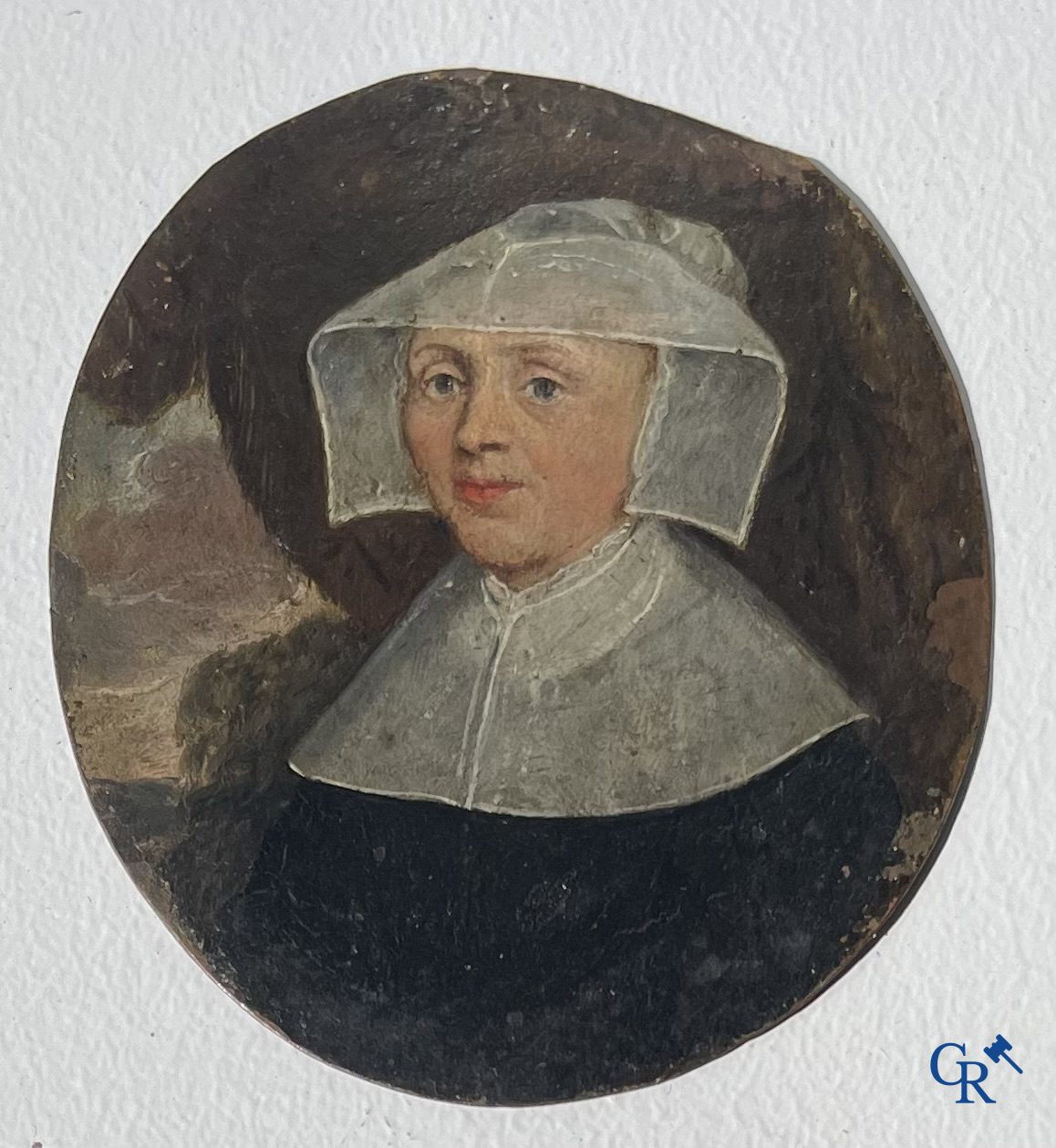 Miniature portrait of a lady in traditional dress with white hood. Oil on copper. 18th-19th century.