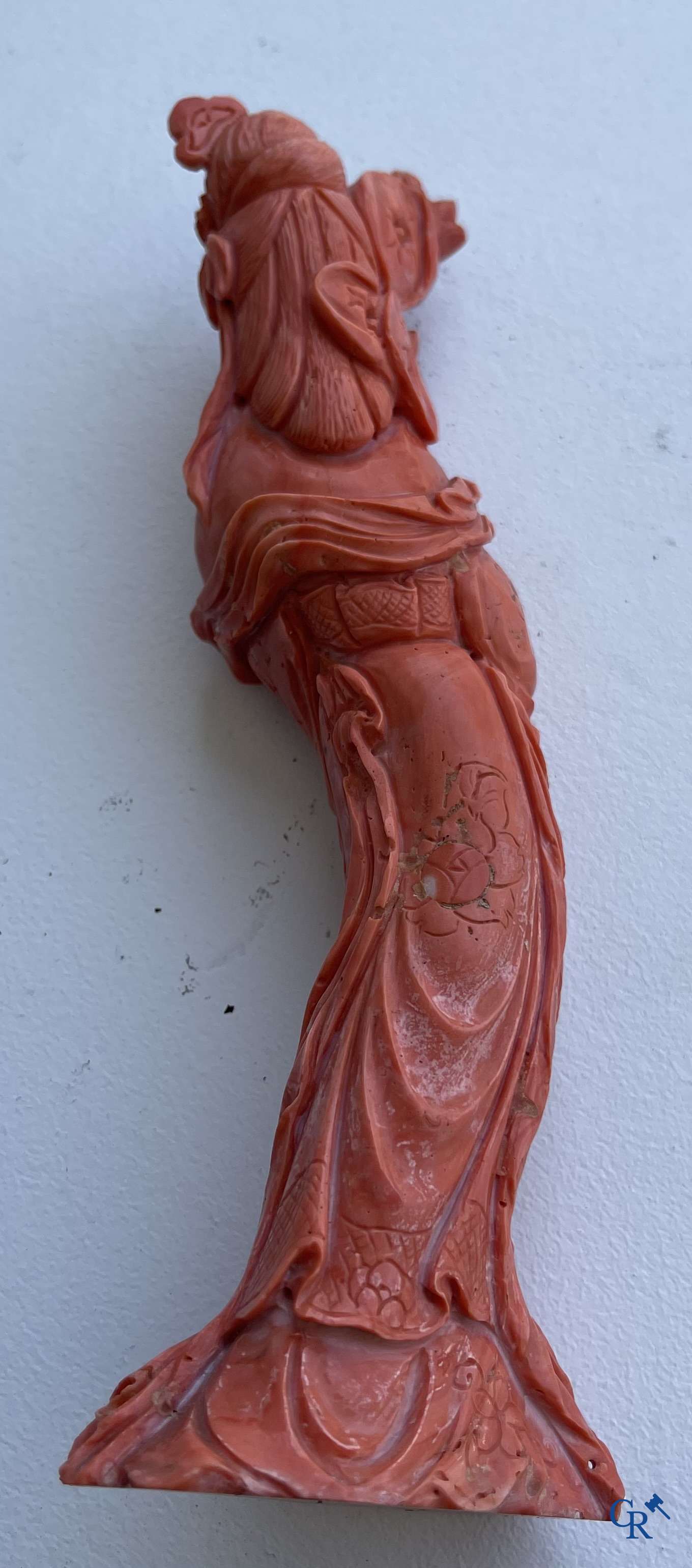 Asian Art, China. A red coral figure of a Chinese lady on a wooden pedestal.