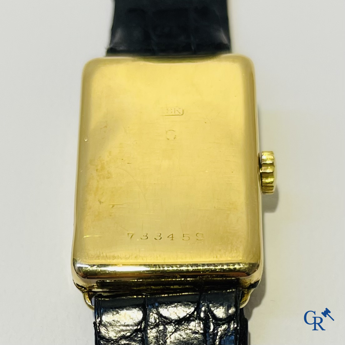 Heren polshorloge in geelgoud 750°/00. Genummerd 733459.